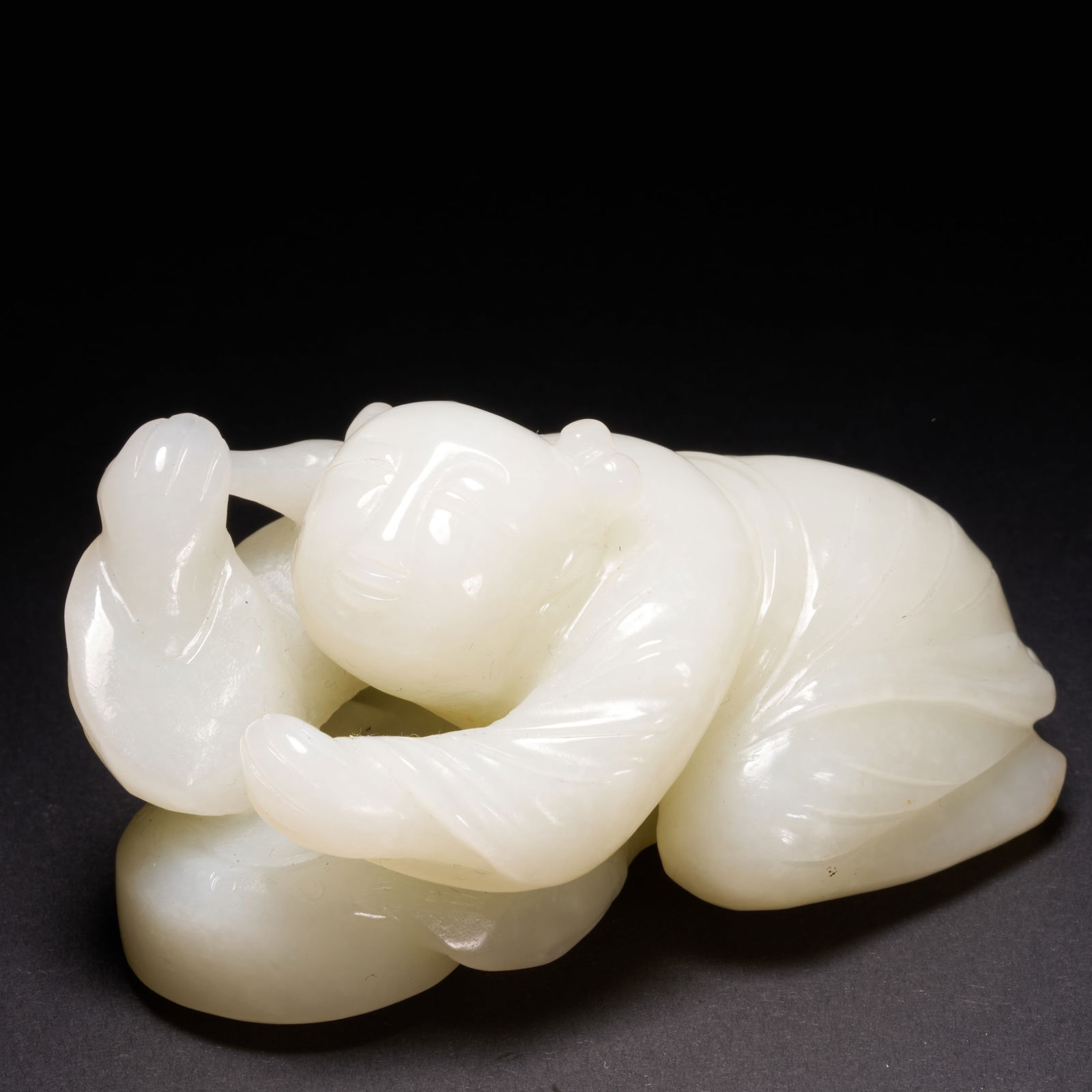 A HETIAN JADE "JOYFUL BOY" ORNAMENT, QING DYNASTY (1 of 8)