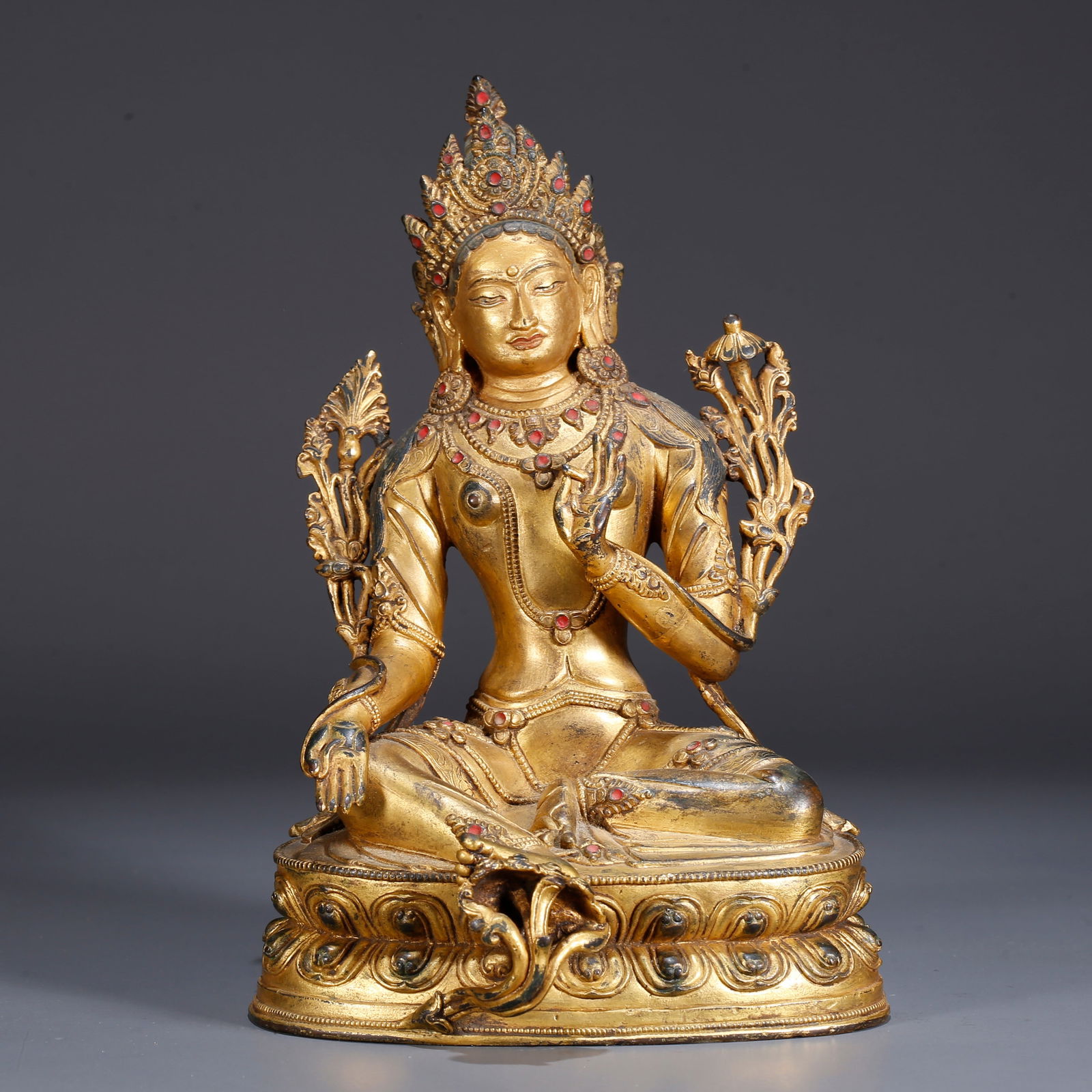 A GILDED BRONZE GREEN TARA STATUE (1 of 9)