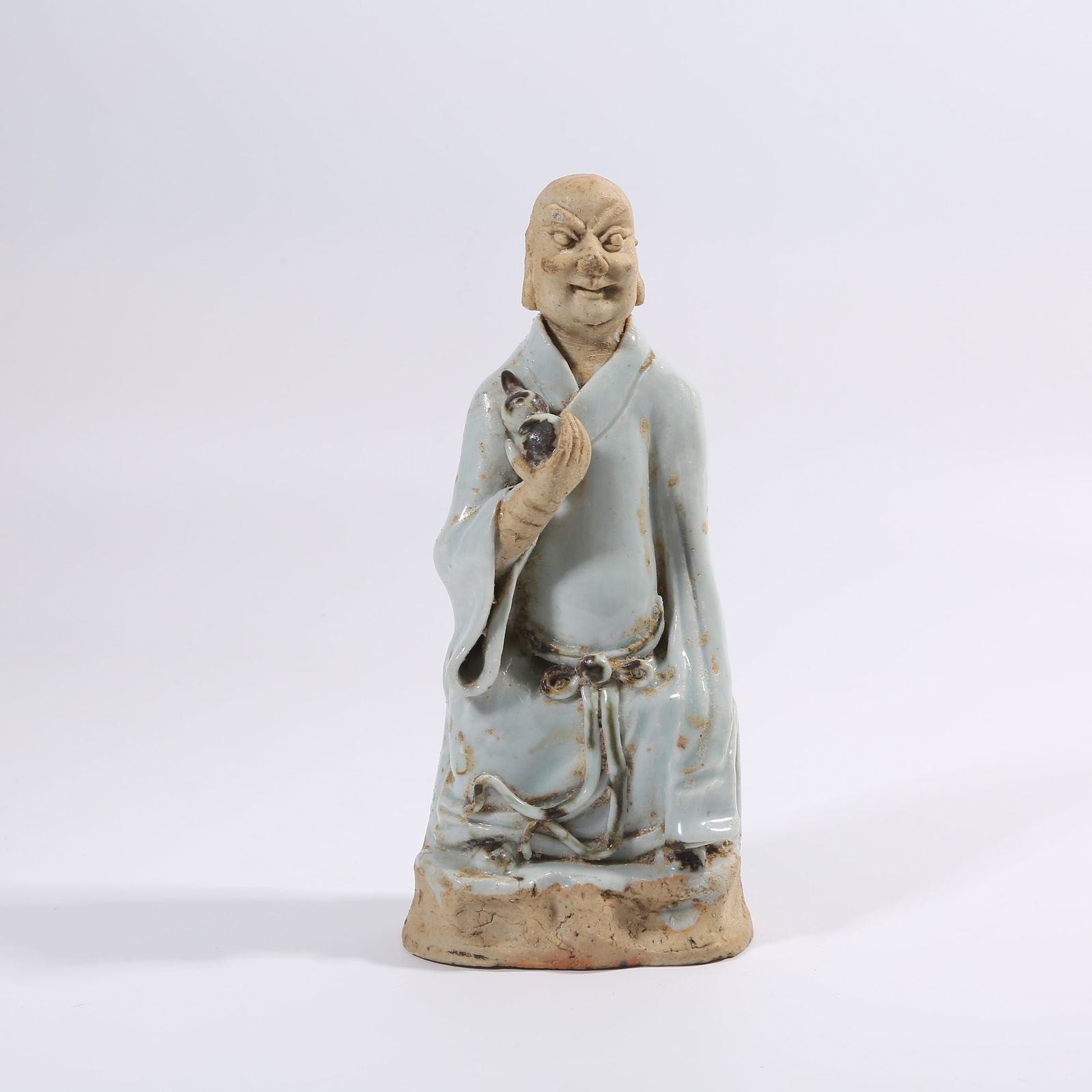 A SONG DYNASTY YINGQING GLAZE ARHAT FIGURINE (1 of 9)