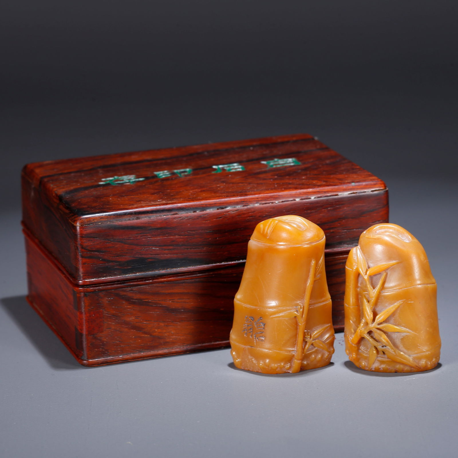 A PAIR OF SHOUSHAN TIANHUANG STONE SEALS CARVED IN BAMBOO SECTION FORM: Pair of Shoushan Tianhuang Stone Seals Carved in Bamboo Section Form