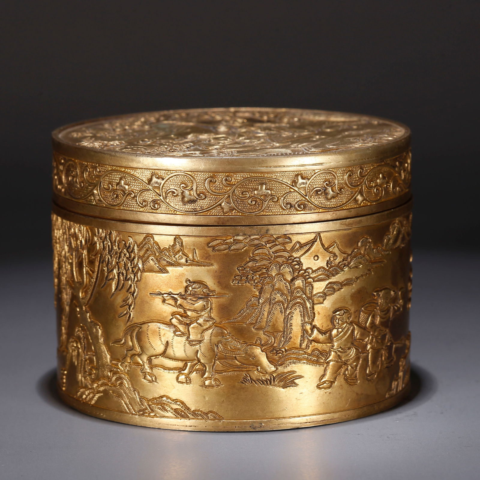 A GILT BRONZE LIDDED BOX WITH FIGURE STORY DESIGN (1 of 9)