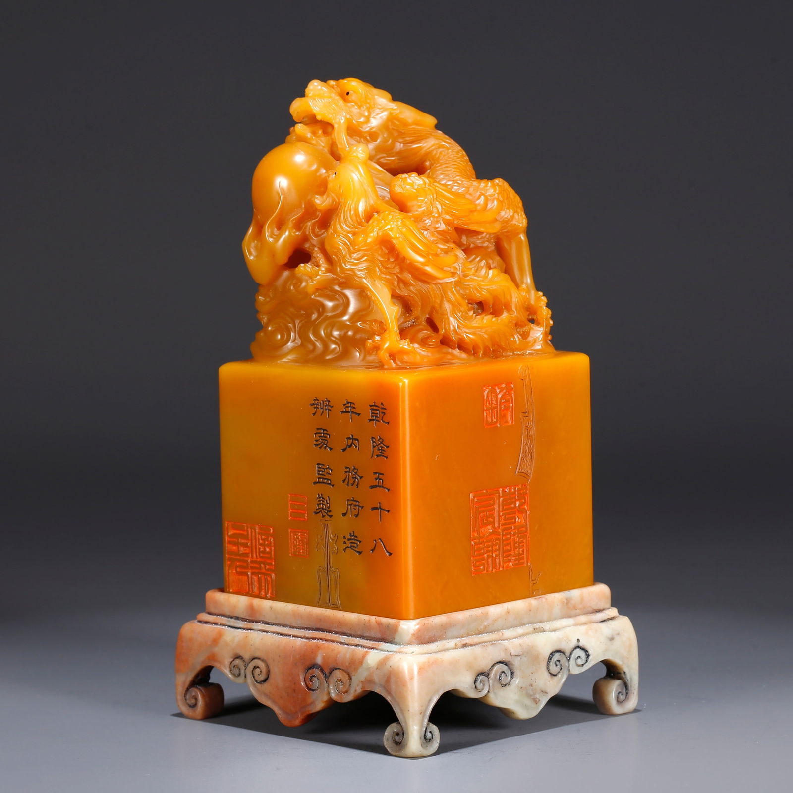 A SHOUSHAN TIANHUANG STONE SEAL WITH DRAGON AND PHOENIX KNOB: Shoushan Tianhuang stone seal with dragon and phoenix knob