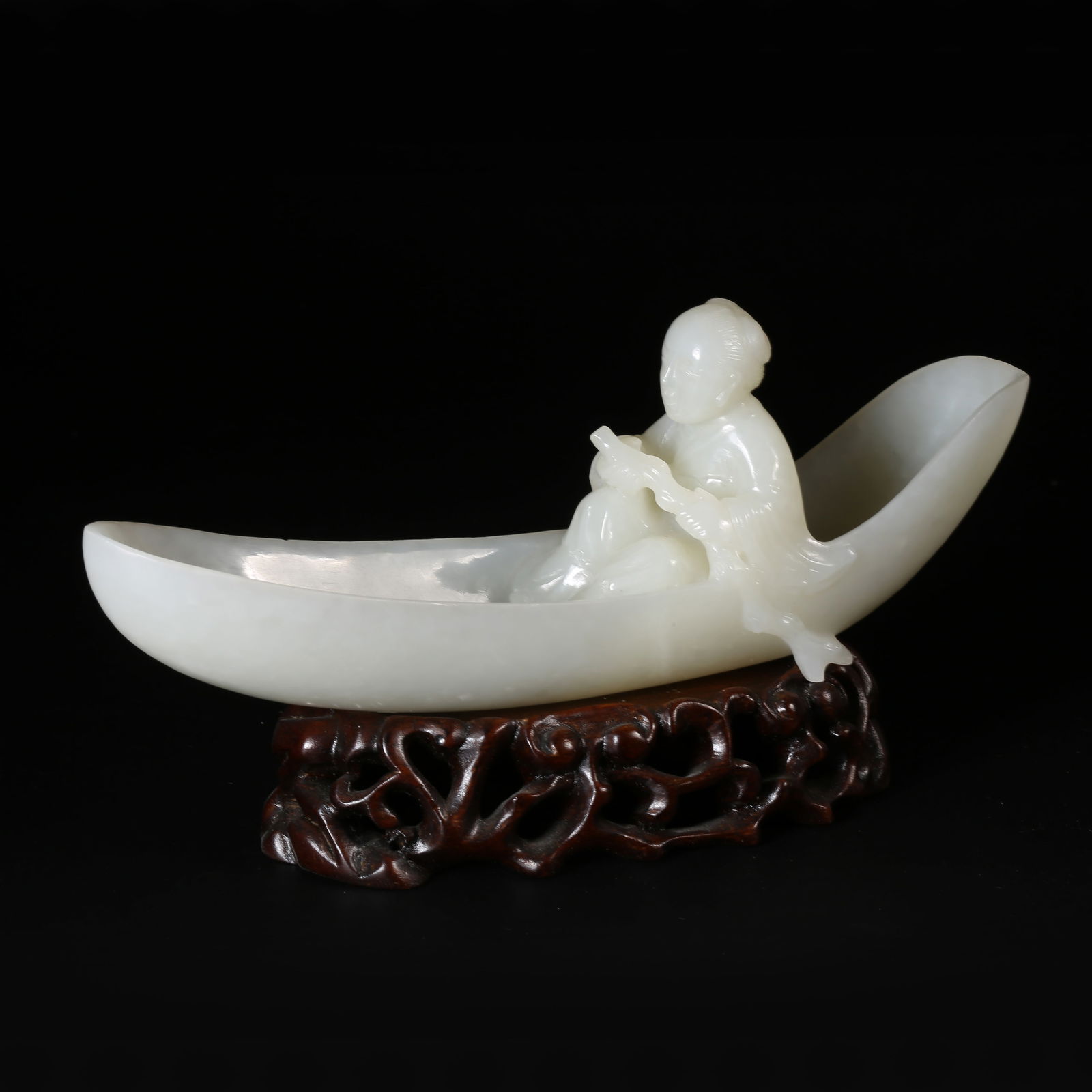 A QING DYNASTY HETIAN WHITE JADE RAFT-RIDING ORNAMENT (1 of 8)