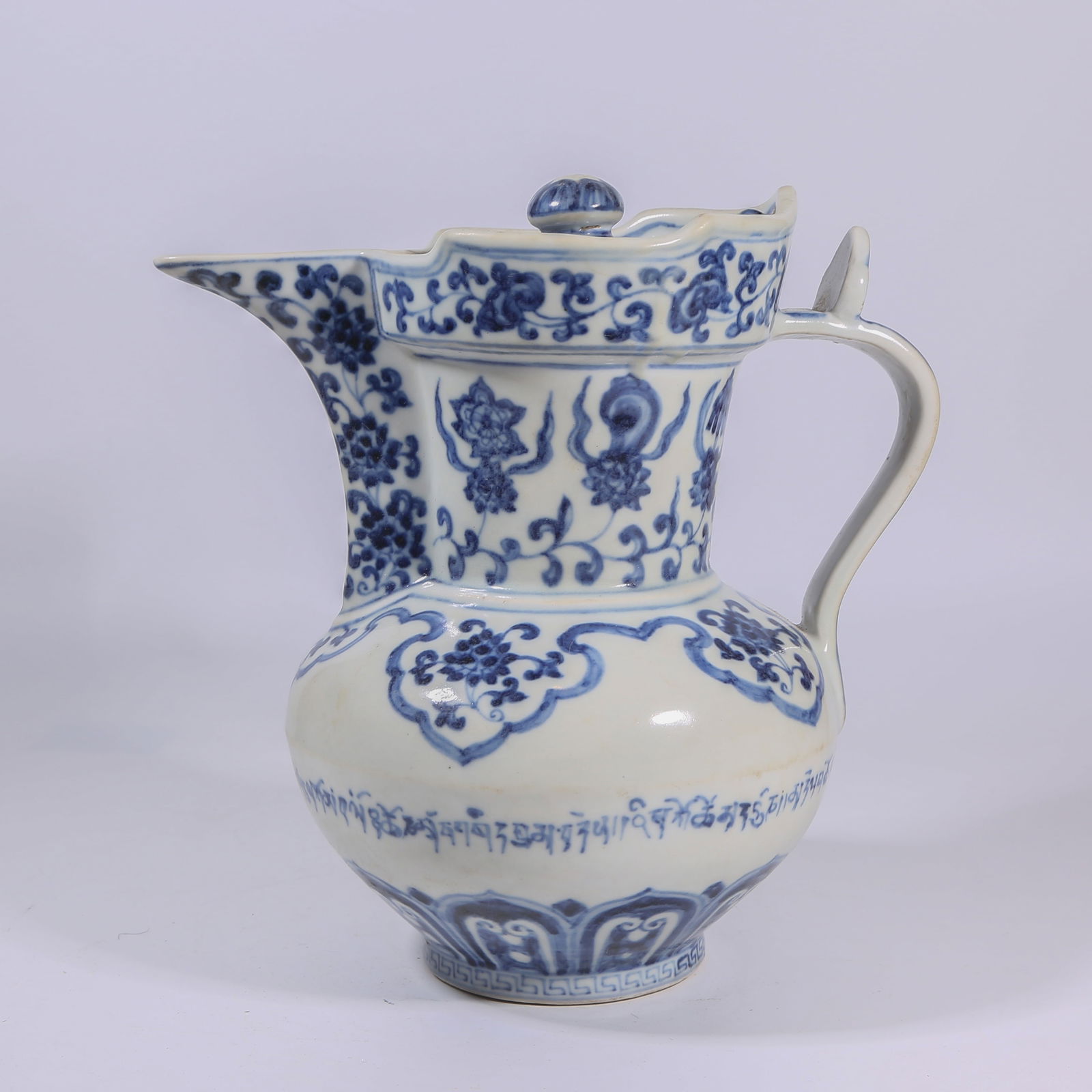 A BLUE-AND-WHITE MONK'S-CAP EWER WITH INTERLACED LOTUS AND THE EIGHT AUSPICIOUS EMBLEMS (1 of 9)