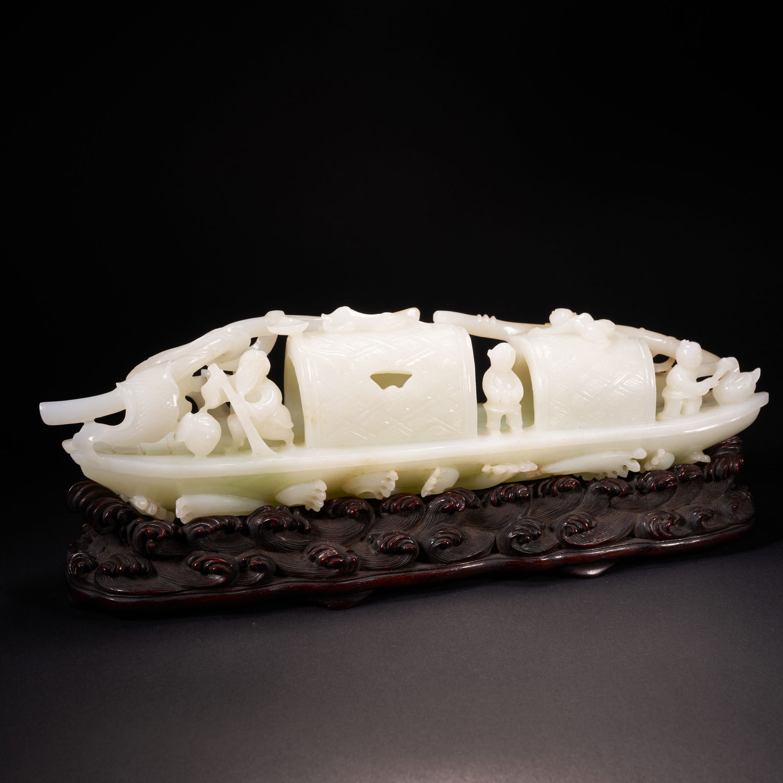 A HETIAN JADE ORNAMENT OF A BOY AND AN OLD FISHERMAN IN A FISHING BOAT, QING DYNASTY (1 of 10)