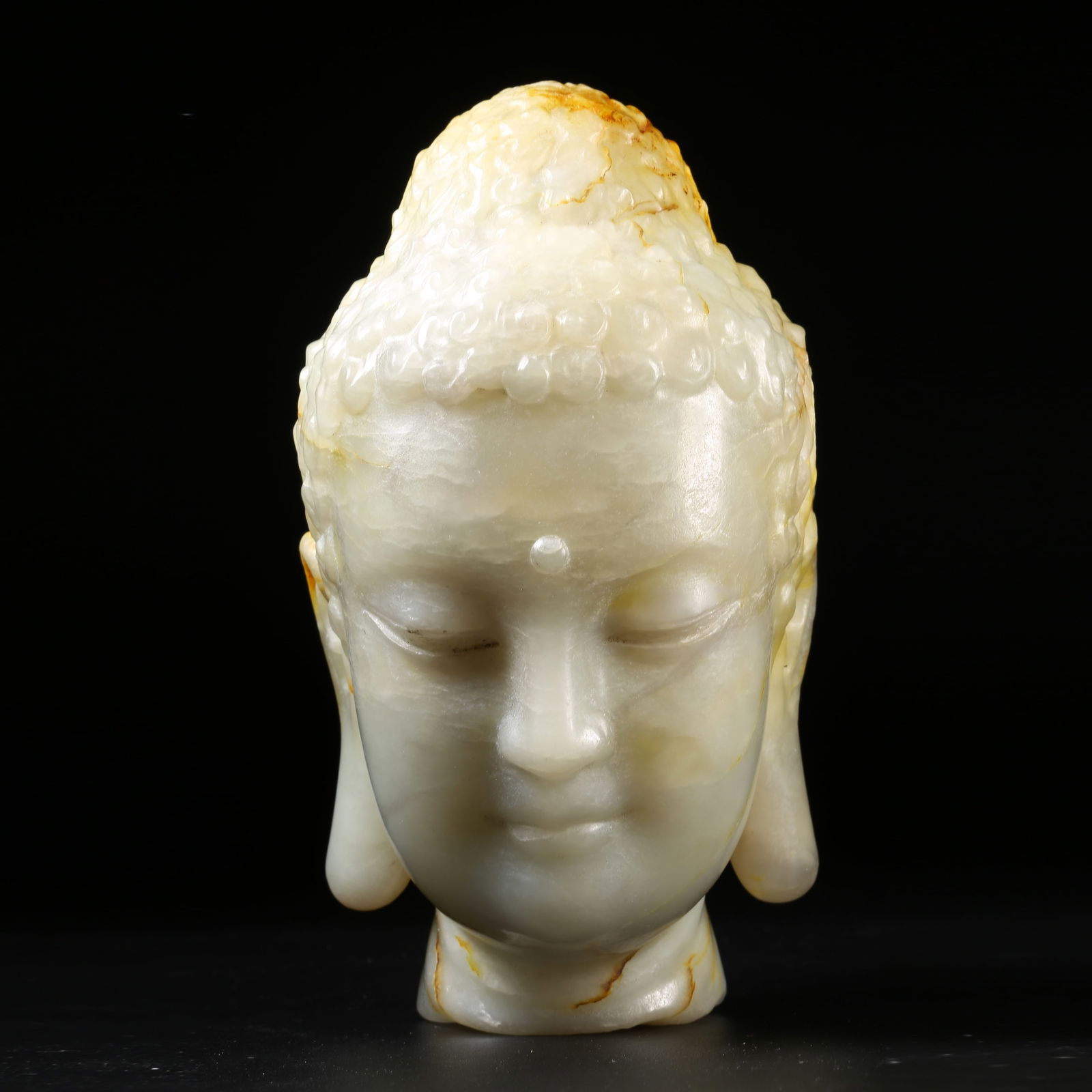 A QING DYNASTY HETIAN JADE BUDDHA HEAD (1 of 8)