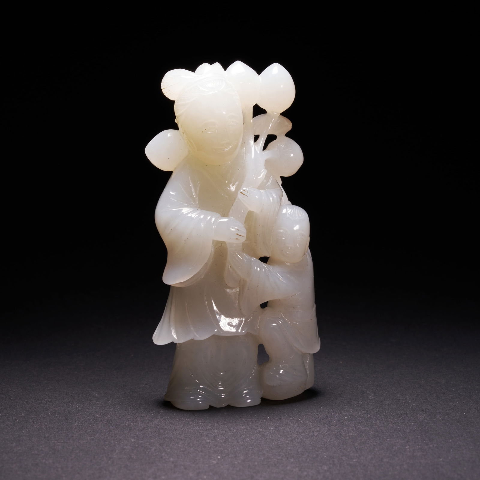 A HETIAN JADE FIGURE ORNAMENT, QING DYNASTY (1 of 9)
