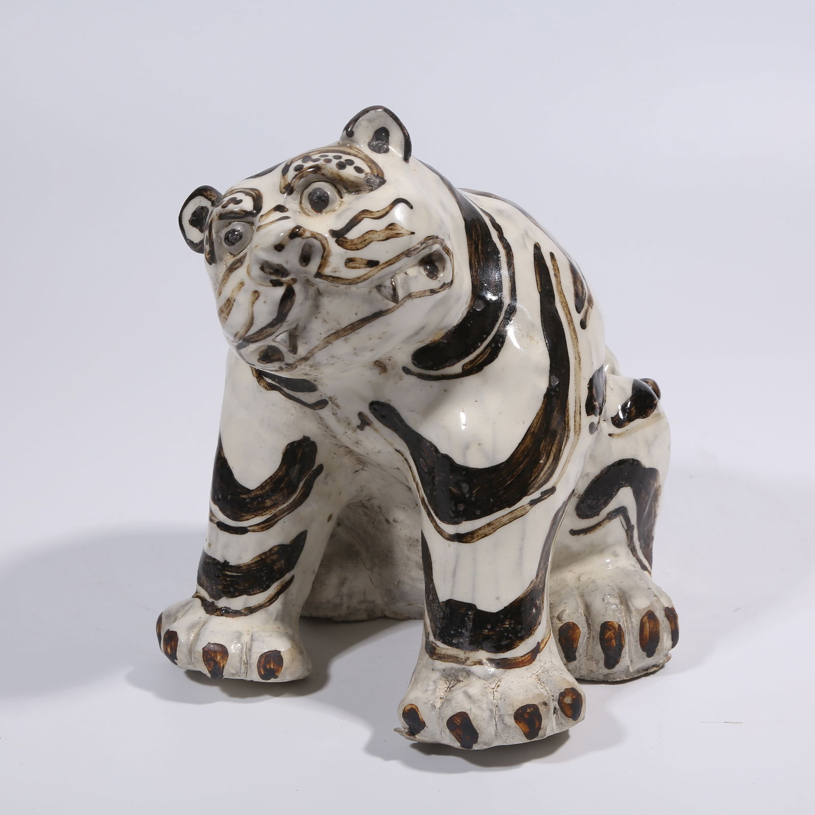 A CIZHOU KILN TIGER FIGURINE: Cizhou Kiln Tiger Figurine