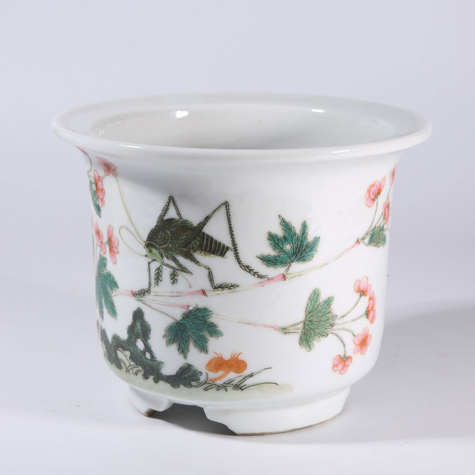 A FAMILLE-ROSE FLOWERPOT WITH INSECT-AND-GRASS MOTIF: Famille-Rose Flowerpot with Insect-and-Grass Motif