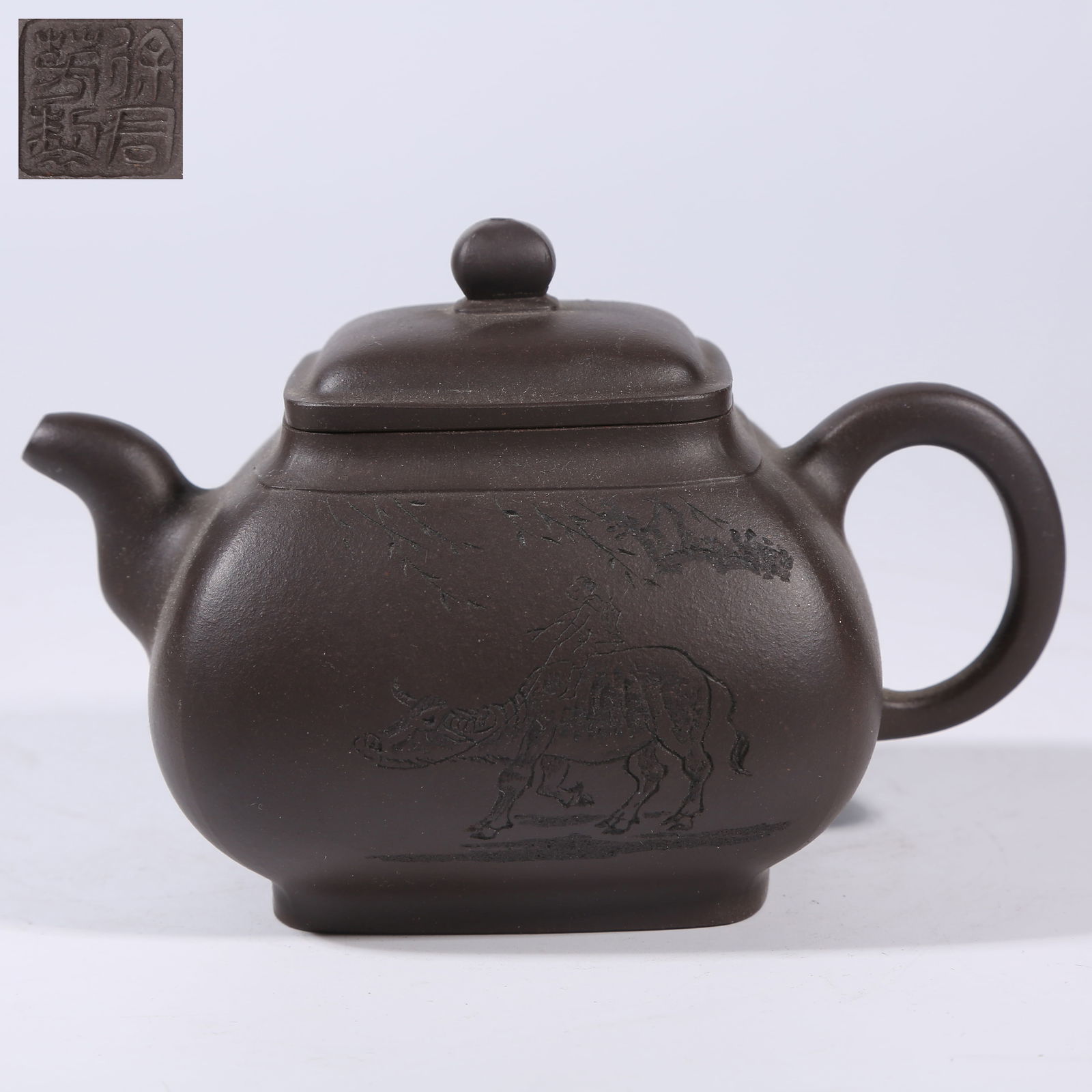 A ZISHA TEAPOT WITH HERDING BOY AND OX MOTIF: Zisha Teapot with Herding Boy and Ox Motif