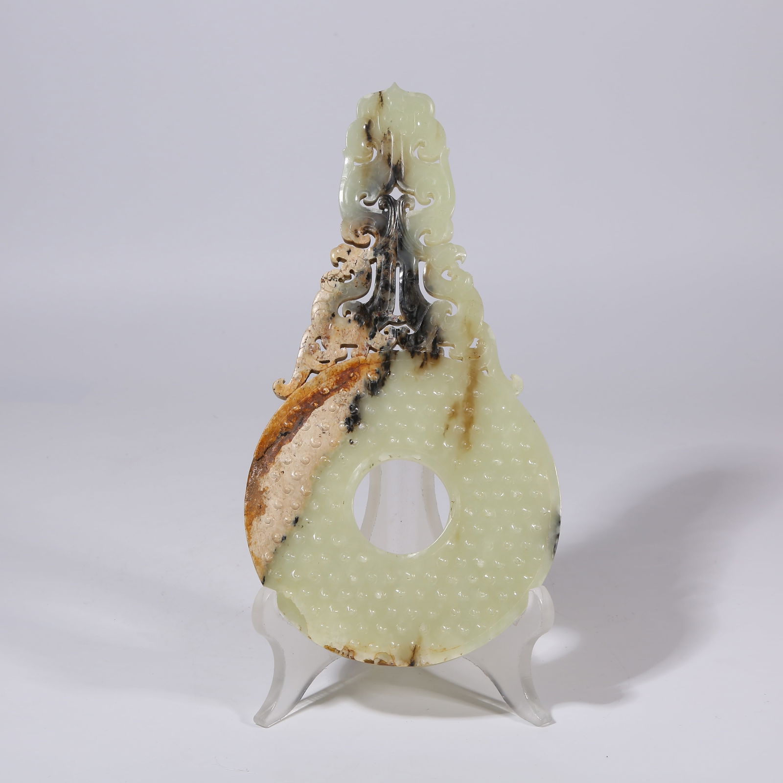 A HIGH-ANTIQUITY JADE BI DISC WITH PHOENIX MOTIFS AND OUTER RELIEF (1 of 8)