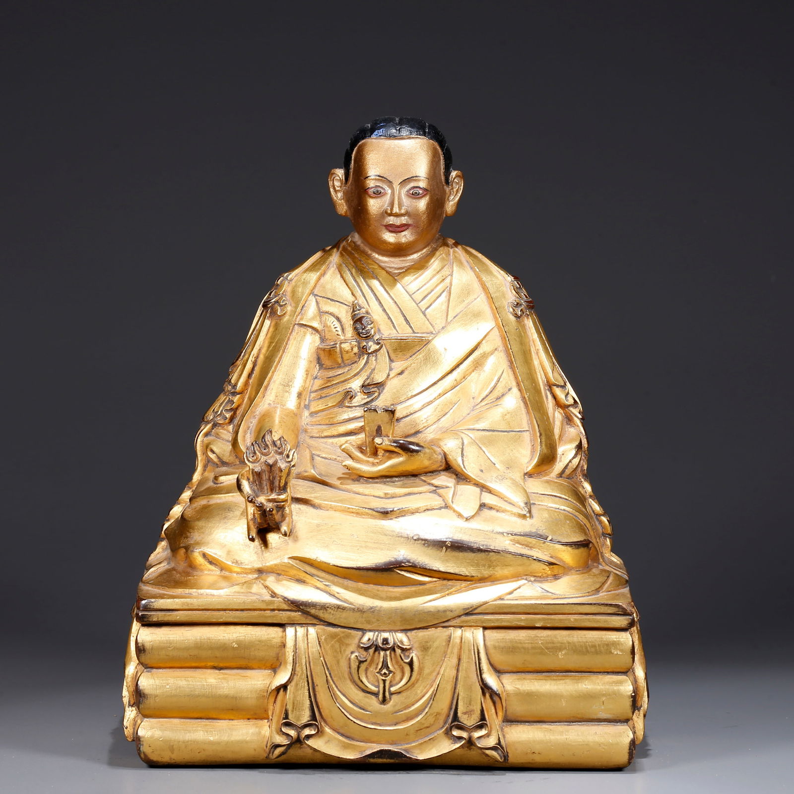 A GILDED BRONZE STATUE OF A LAMA (1 of 9)