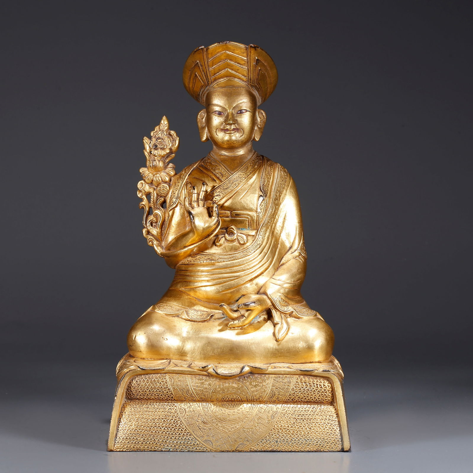 A GILDED BRONZE STATUE OF A LAMA (1 of 9)