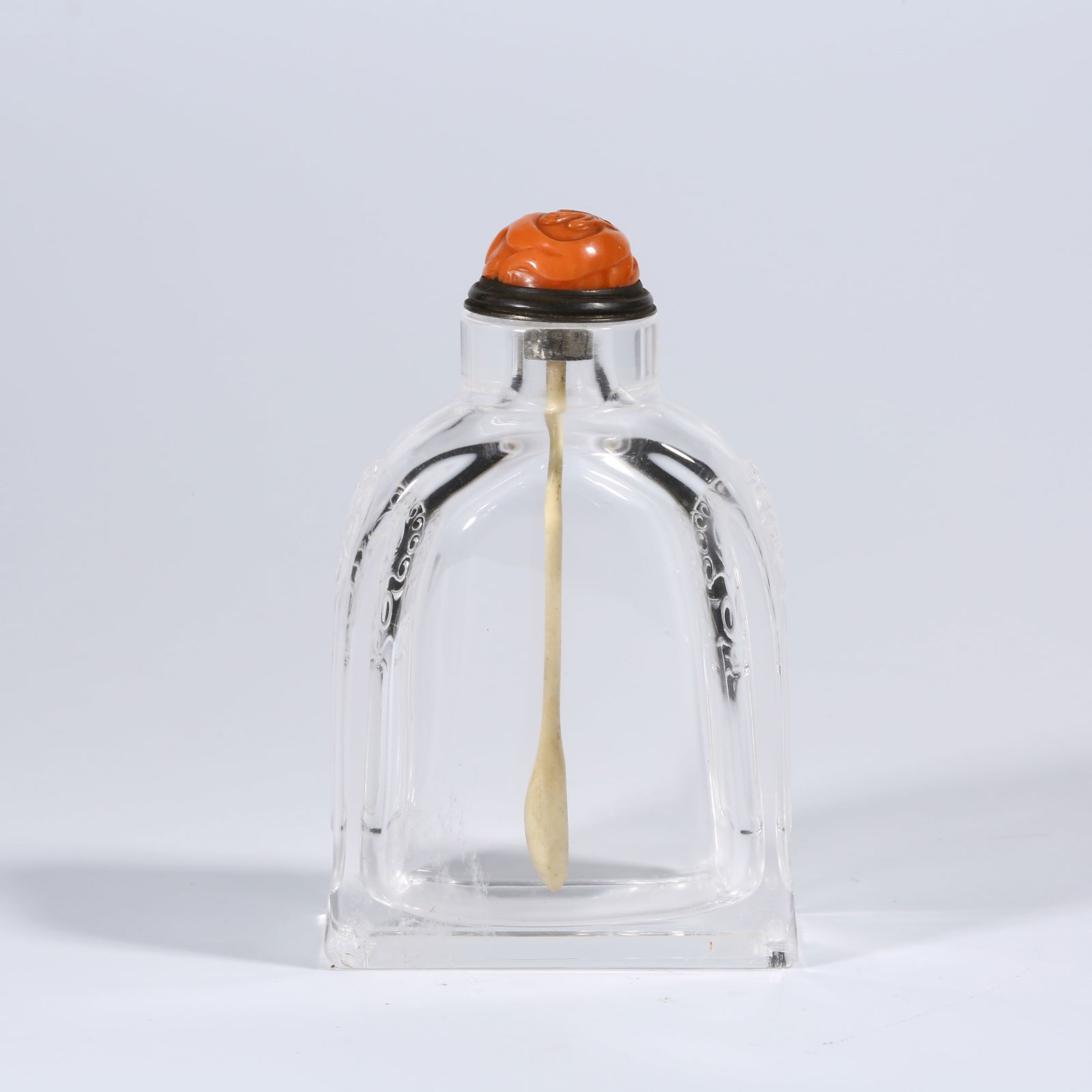 A CRYSTAL SNUFF BOTTLE WITH ANIMAL-HEAD HANDLES: Crystal Snuff Bottle with Animal-Head Handles