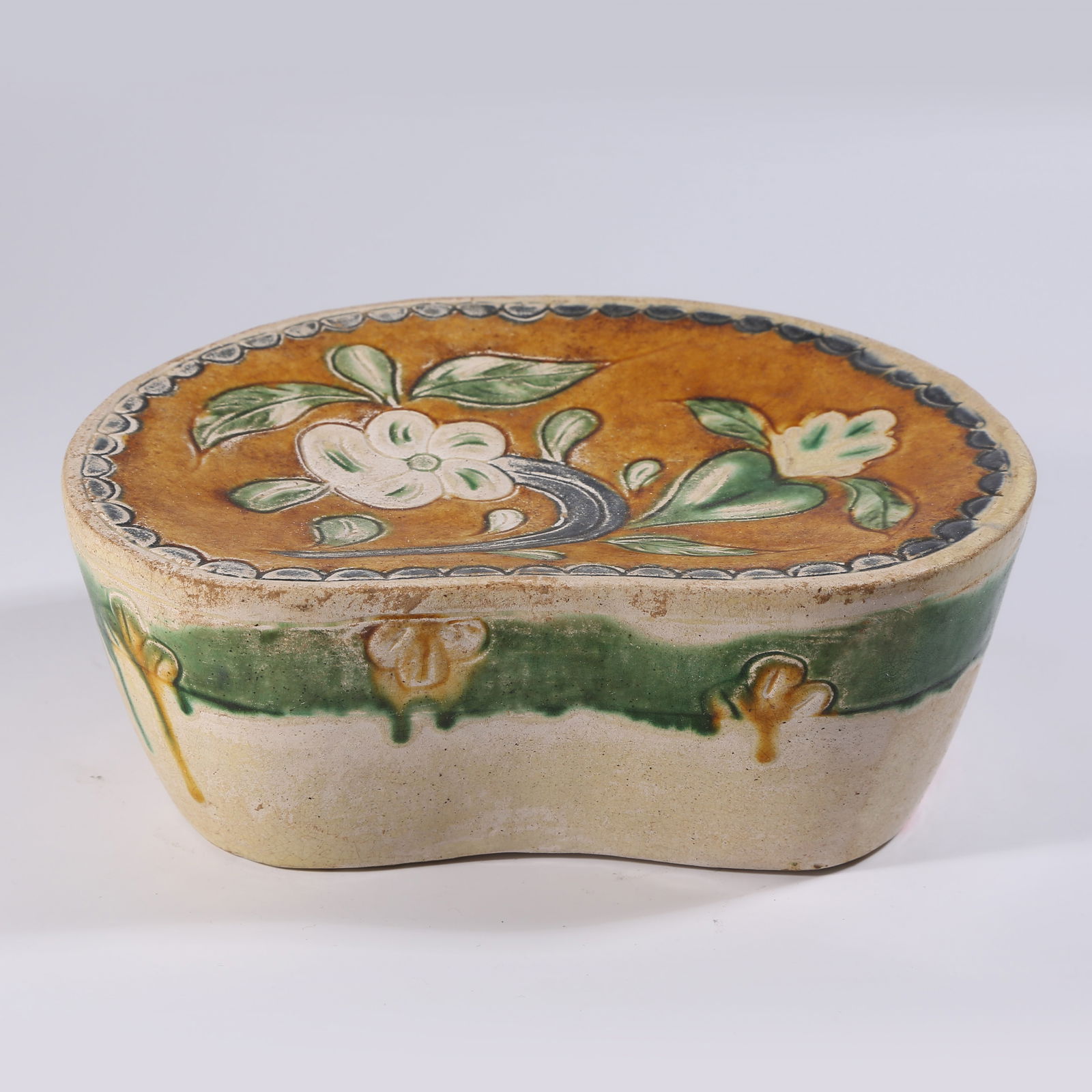 A LIAO DYNASTY SANCAI FLOWER PATTERN PILLOW (1 of 8)