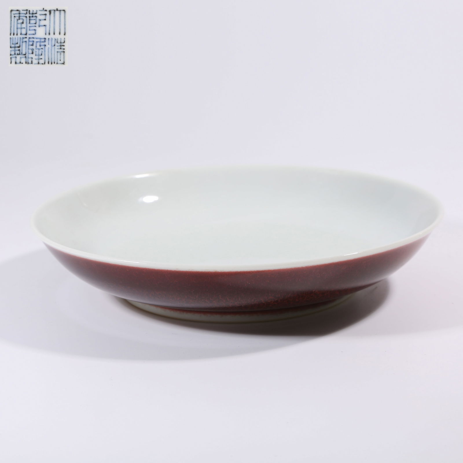 A QING DYNASTY RED-GLAZE PLATE (1 of 9)