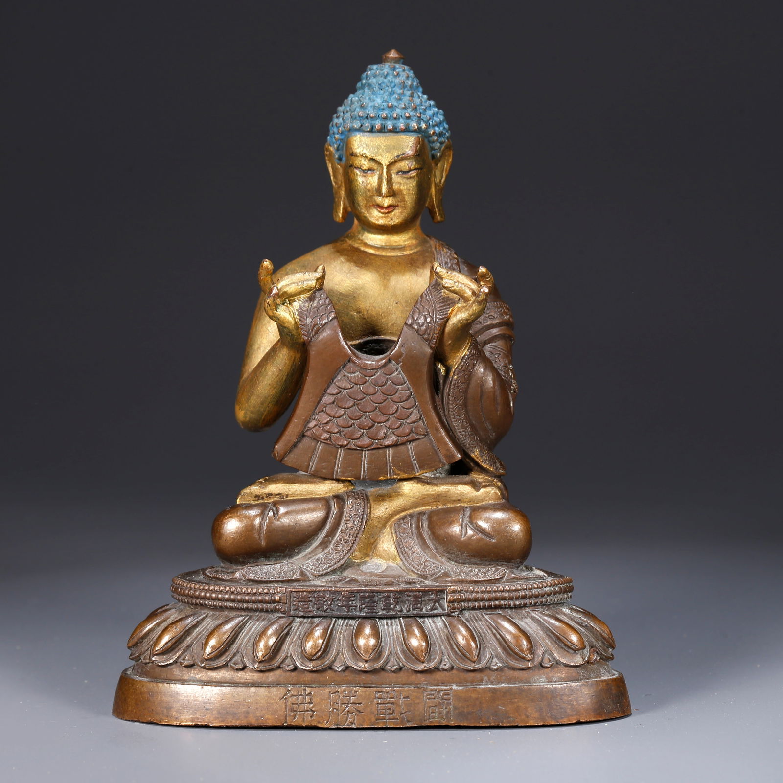 A GILT BRONZE STATUE OF A BUDDHA: Gilt bronze statue of a Buddha