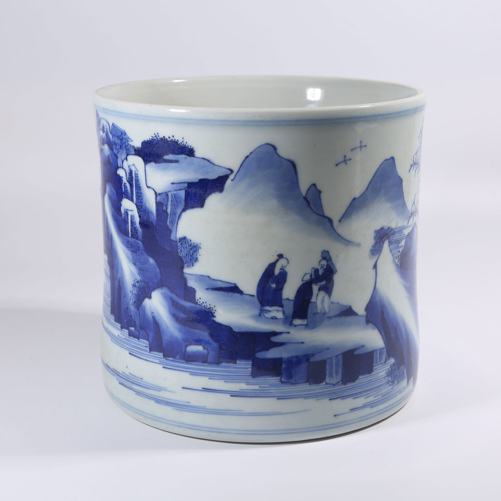 A QING DYNASTY KANGXI BLUE-AND-WHITE LANDSCAPE BRUSH POT (1 of 9)