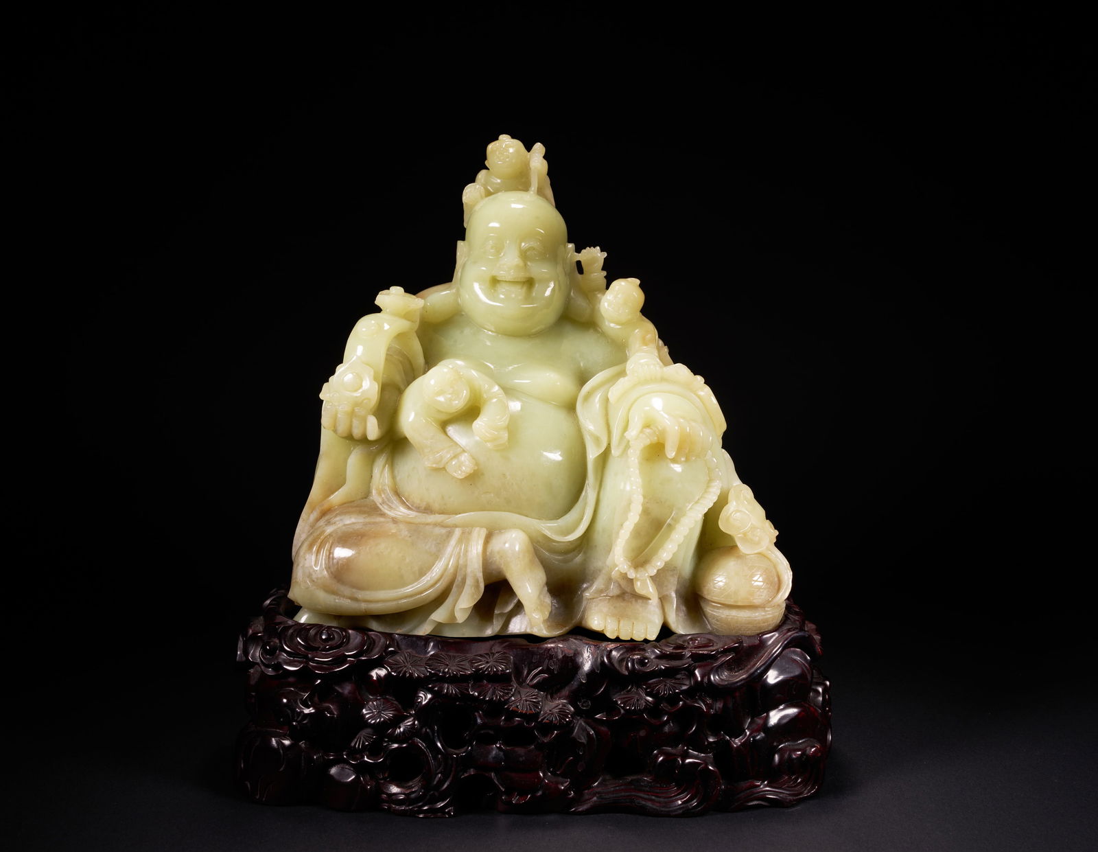 A HETIAN YELLOW JADE "BOYS TEASING THE BUDDHA" ORNAMENT, QING DYNASTY: Hetian yellow jade "Boys Teasing the Buddha" ornament, Qing Dynasty