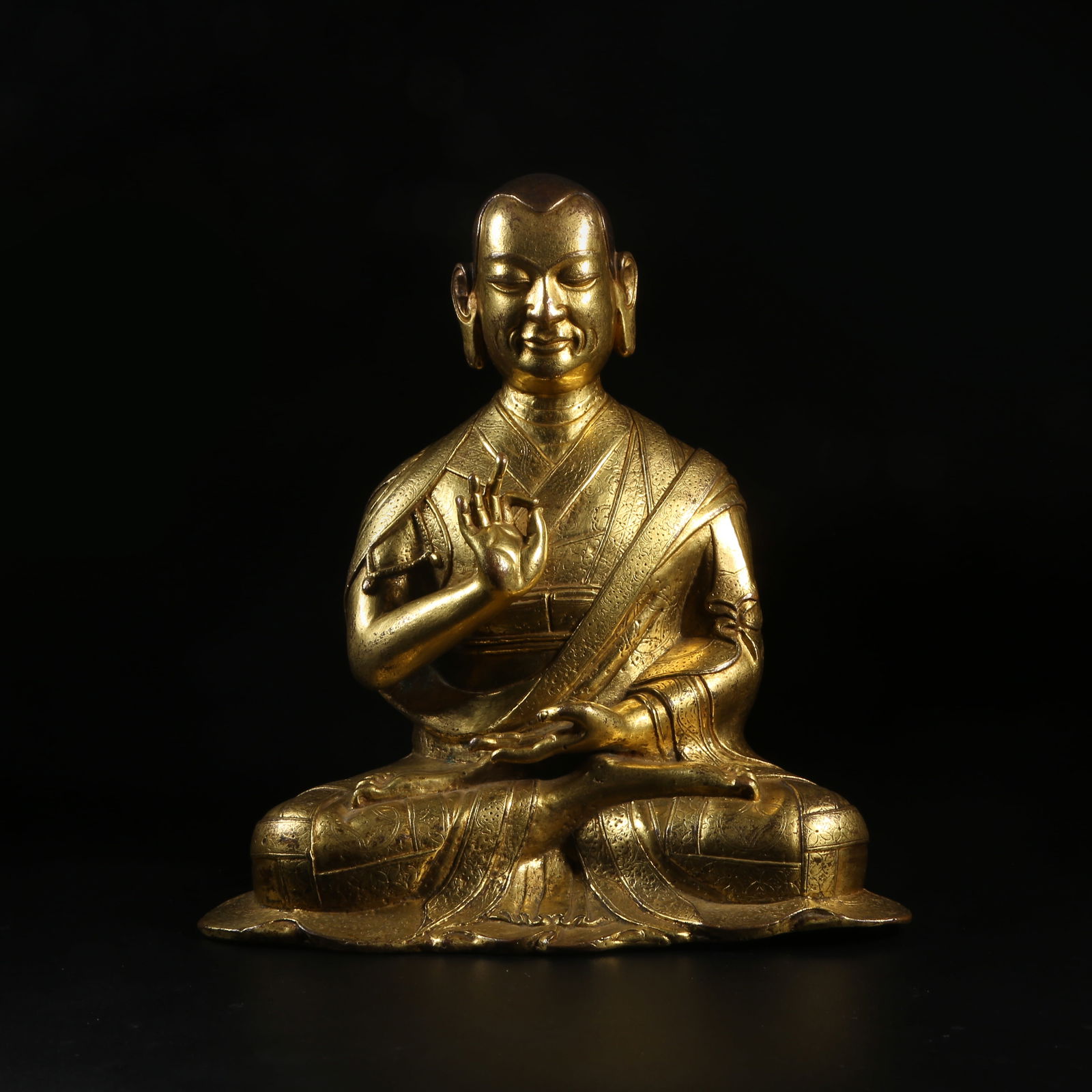 A GILT-BRONZE LAMA STATUE (1 of 9)