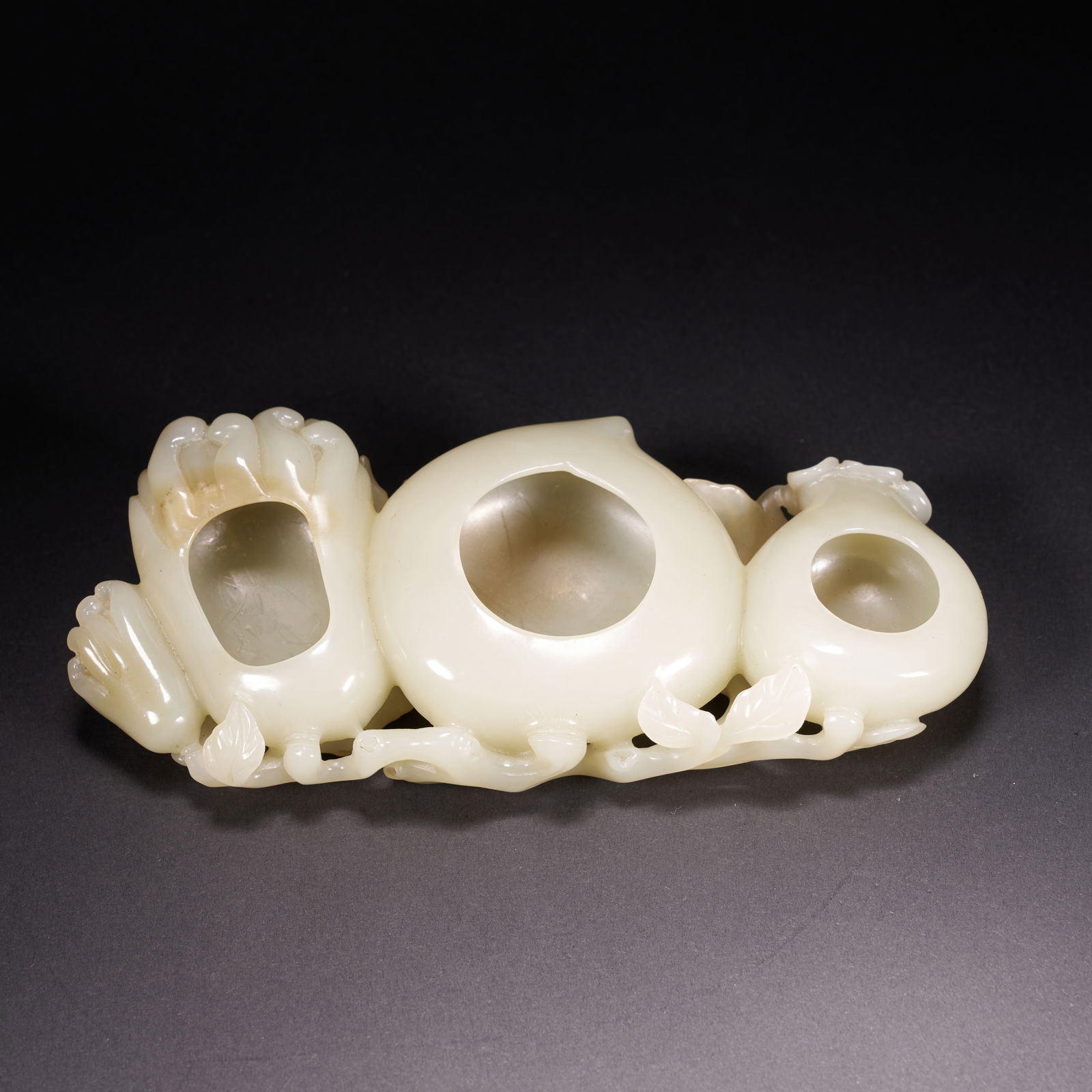 A HETIAN JADE FULU SHOU (FORTUNE, PROSPERITY, AND LONGEVITY)-SHAPED BASIN, QING DYNASTY (1 of 9)