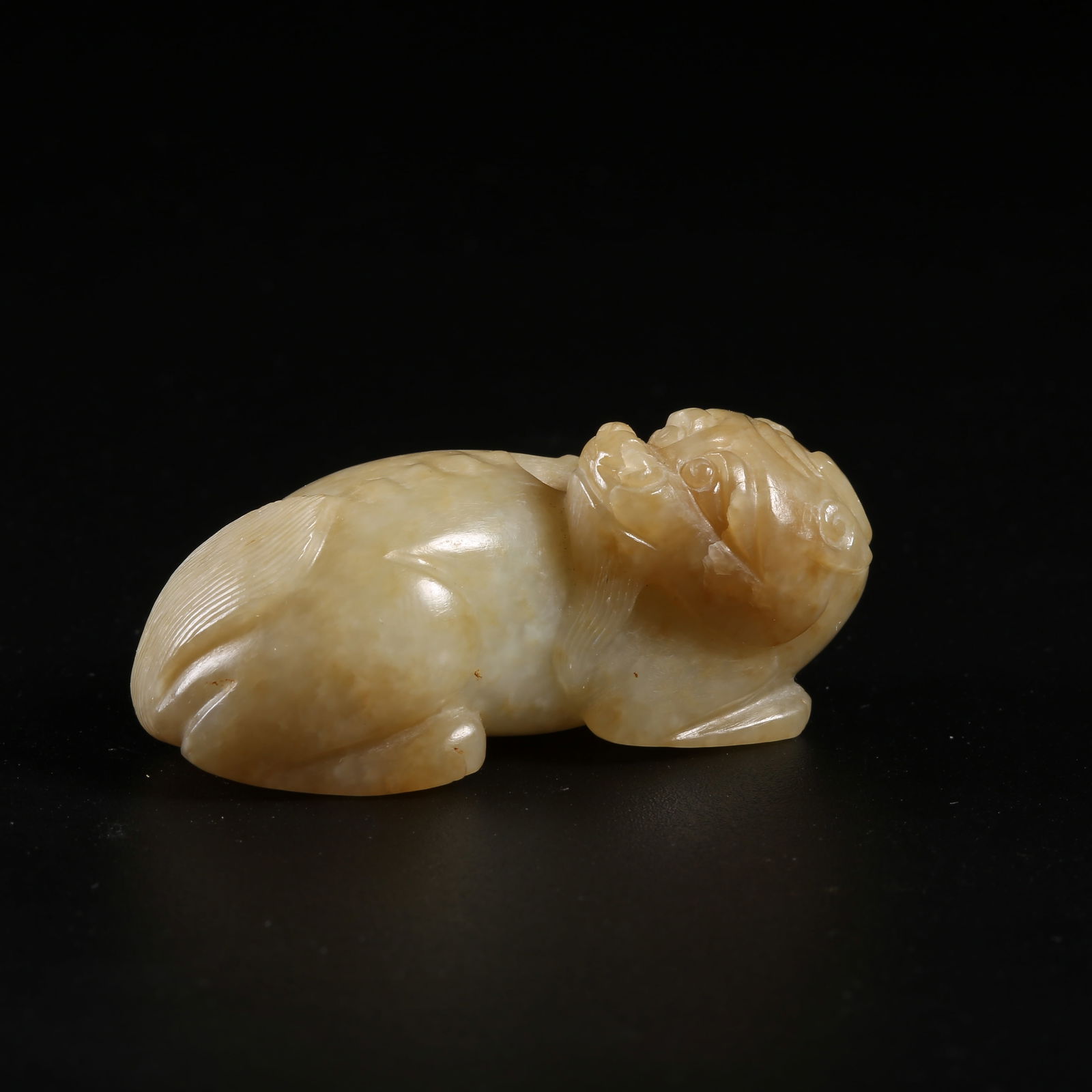 A ANCIENT JADE AUSPICIOUS BEAST PENDANT (1 of 8)