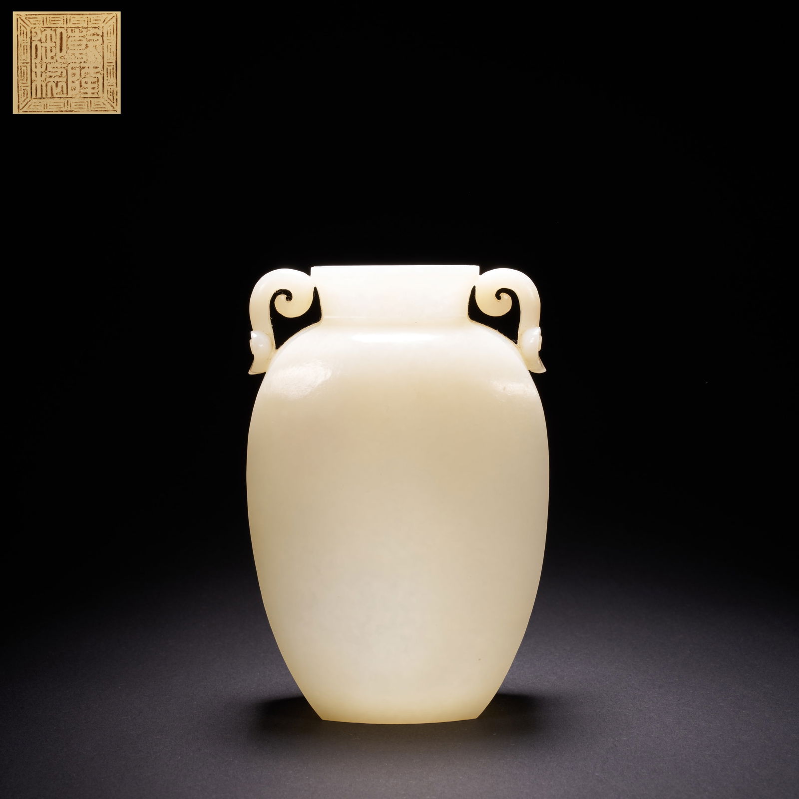 A HETIAN JADE FLATTENED VASE WITH RUYI-SHAPED HANDLES, QING DYNASTY (1 of 9)