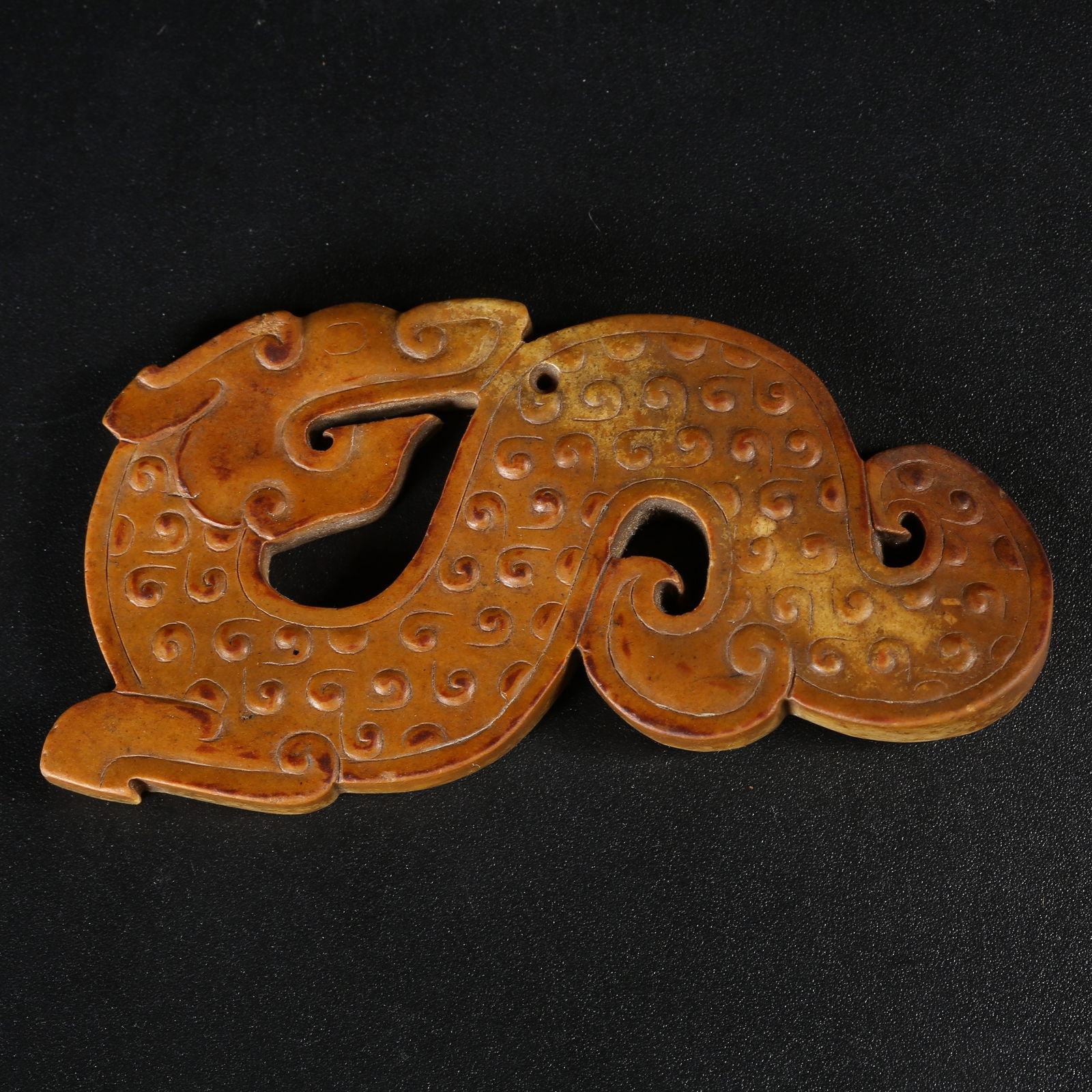 A SONG DYNASTY HETIAN JADE DRAGON-SHAPED PENDANT: Song Dynasty Hetian Jade Dragon-Shaped Pendant