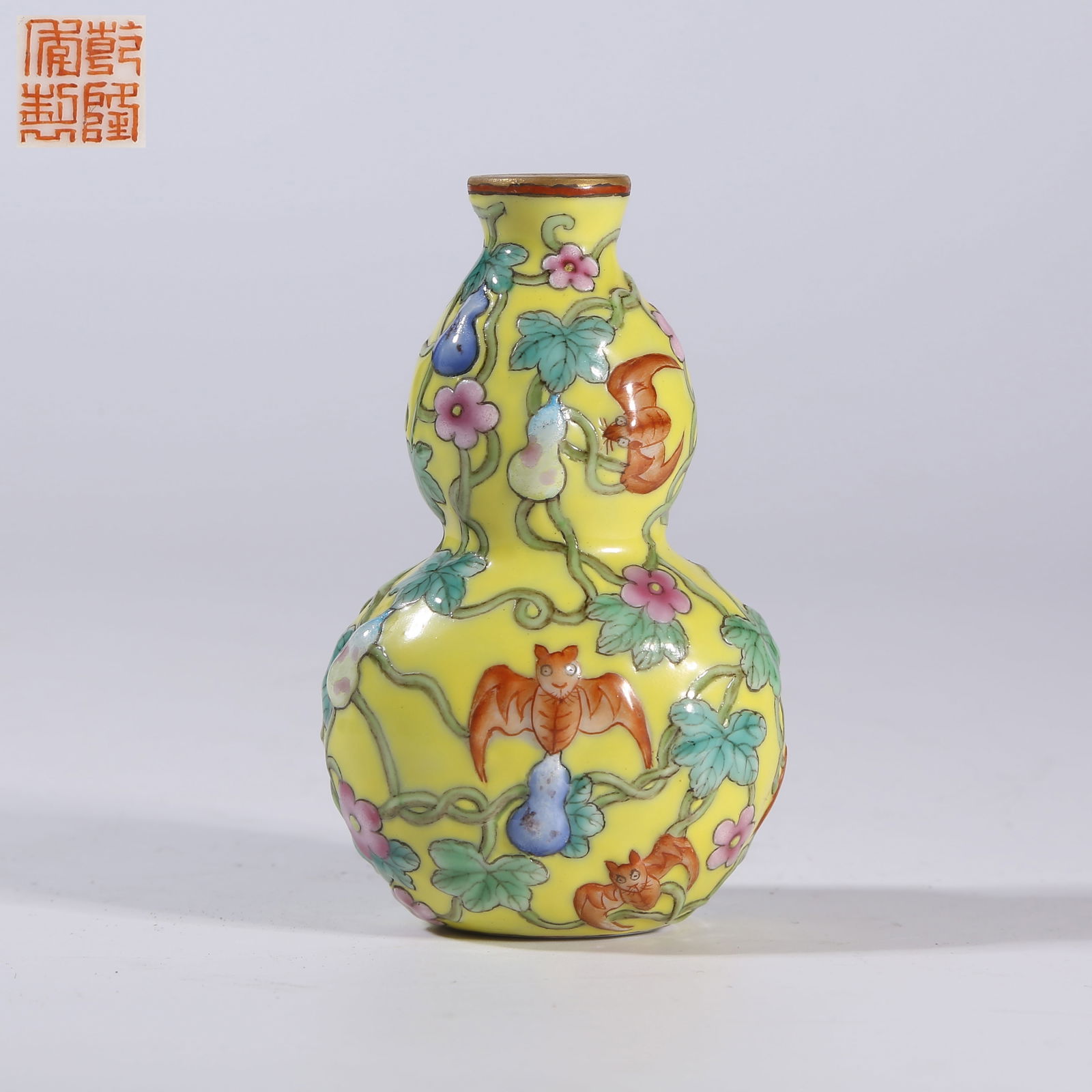 A YELLOW-GROUND FAMILLE-ROSE SNUFF BOTTLE WITH "BLESSING AND PROSPERITY FOR TEN THOUSAND (1 of 9)
