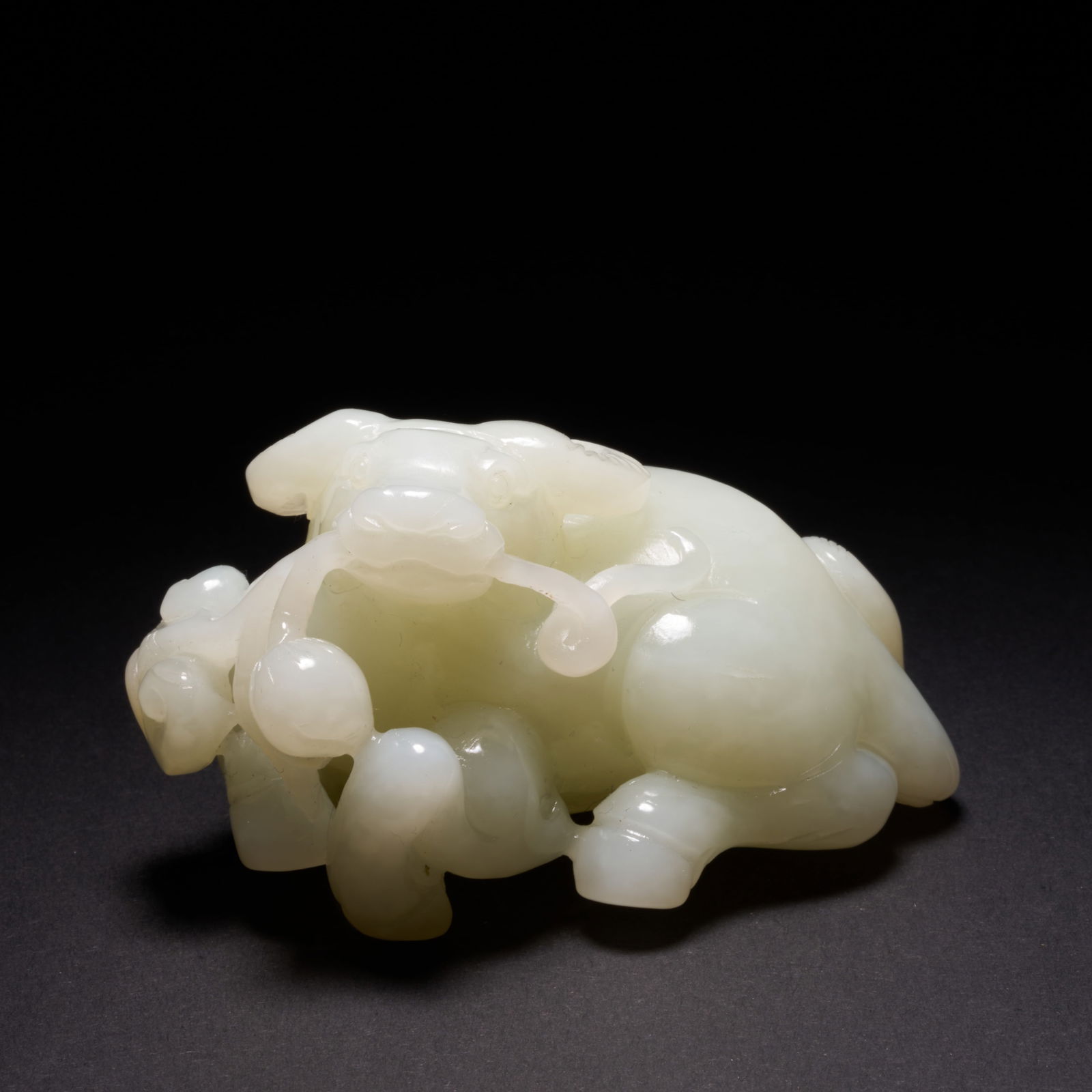 A HETIAN JADE OX HAND-HELD CARVING, QING DYNASTY (1 of 10)