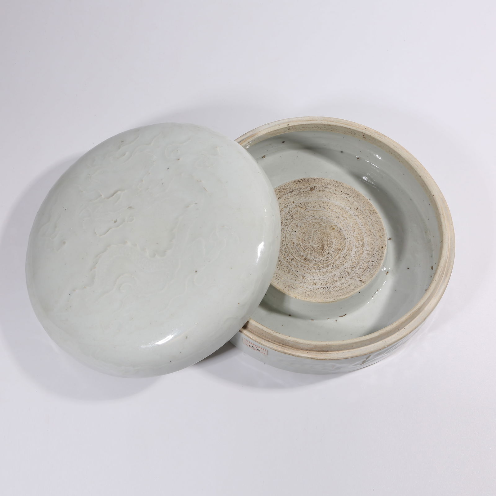 A YUAN DYNASTY SHUFU-GLAZED COVERED BOX WITH INCISED DRAGON CHASING PEARL PATTERN (1 of 9)