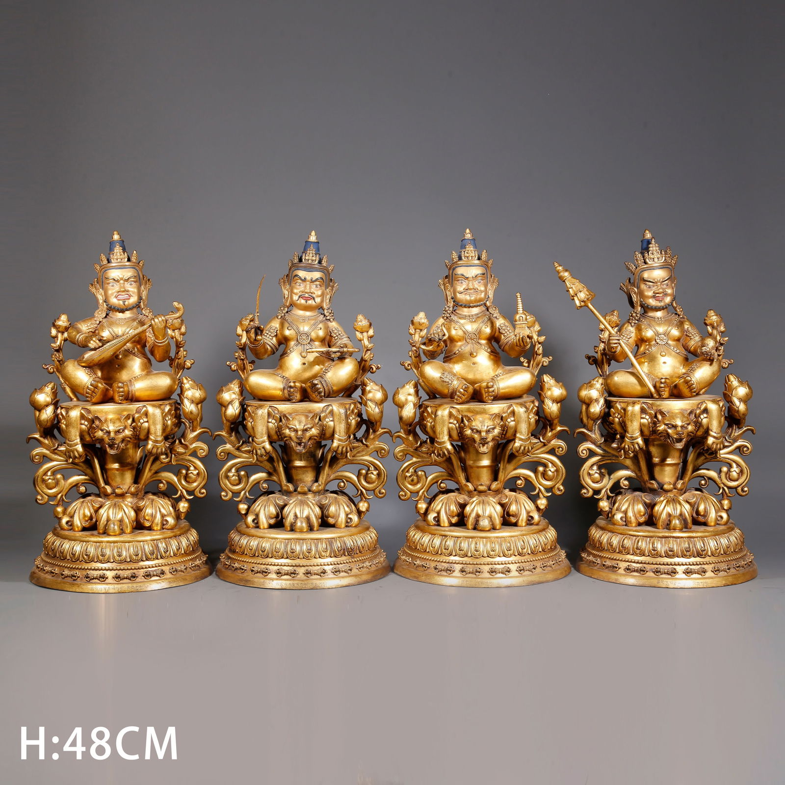A GILDED BRONZE FOUR HEAVENLY KINGS STATUES (A SET) (1 of 11)