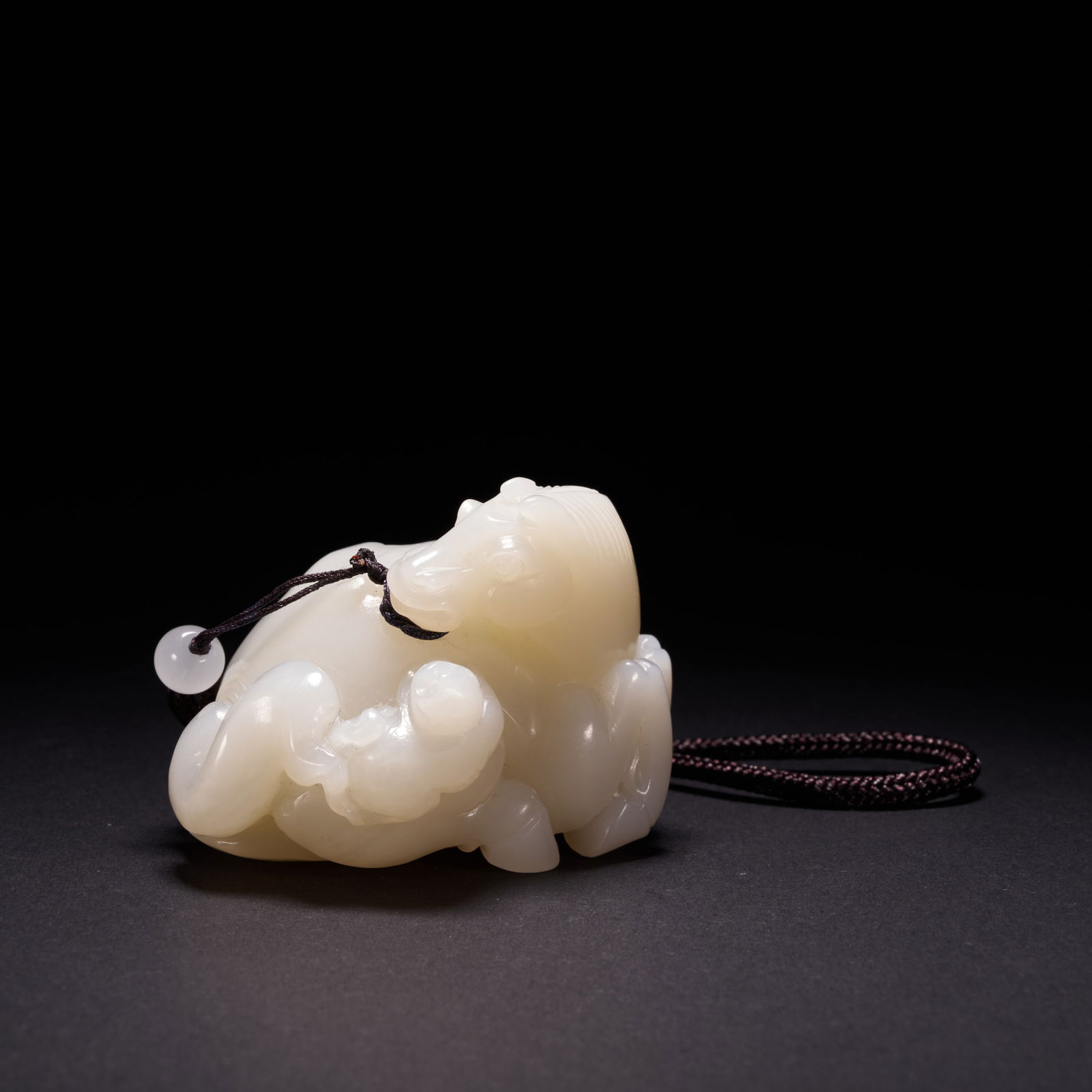 A HETIAN JADE "IMMEDIATE PROMOTION" (MASHANG FENGHOU) ORNAMENT, QING DYNASTY (1 of 7)