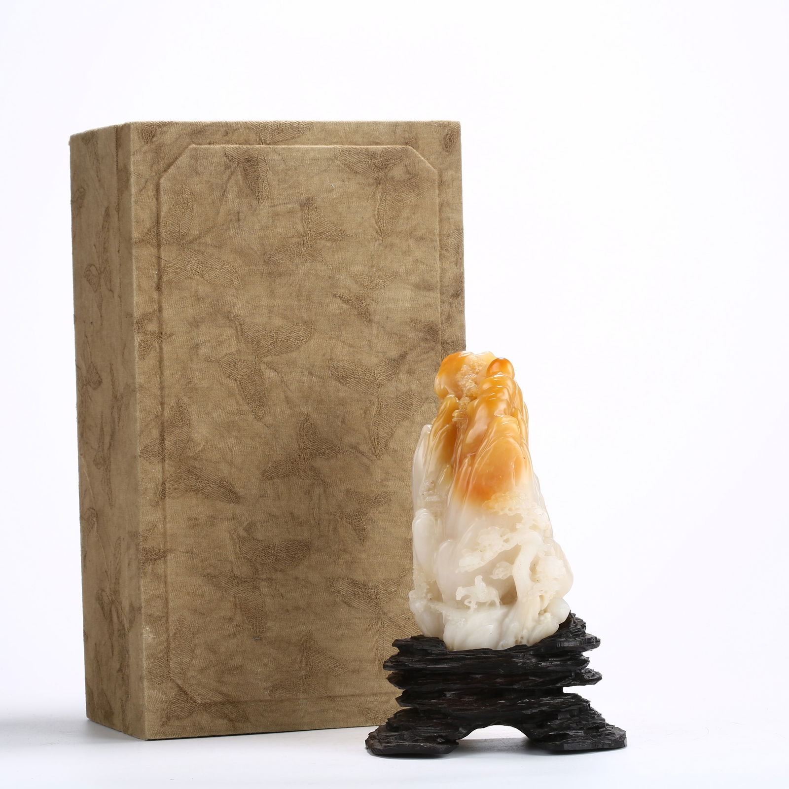 A SHOUSHAN STONE SEAL WITH LANDSCAPE AND FIGURE CARVING IN MOUNTAIN-SHAPED DESIGN: Shoushan stone seal with landscape and figure carving in mountain-shaped design