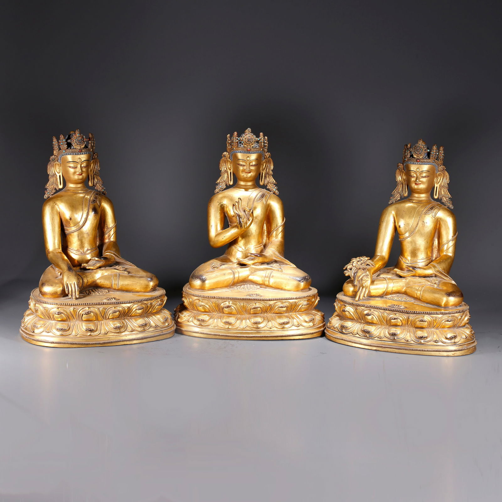 A SET OF GILDED BRONZE BUDDHA STATUES: Set of Gilded Bronze Buddha Statues