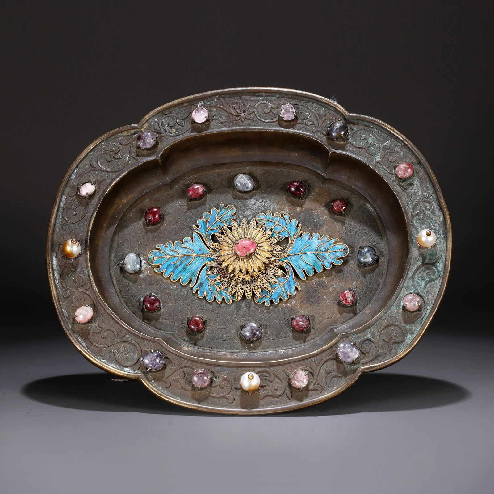 A BRONZE PLATE WITH FLORAL DESIGN (1 of 9)