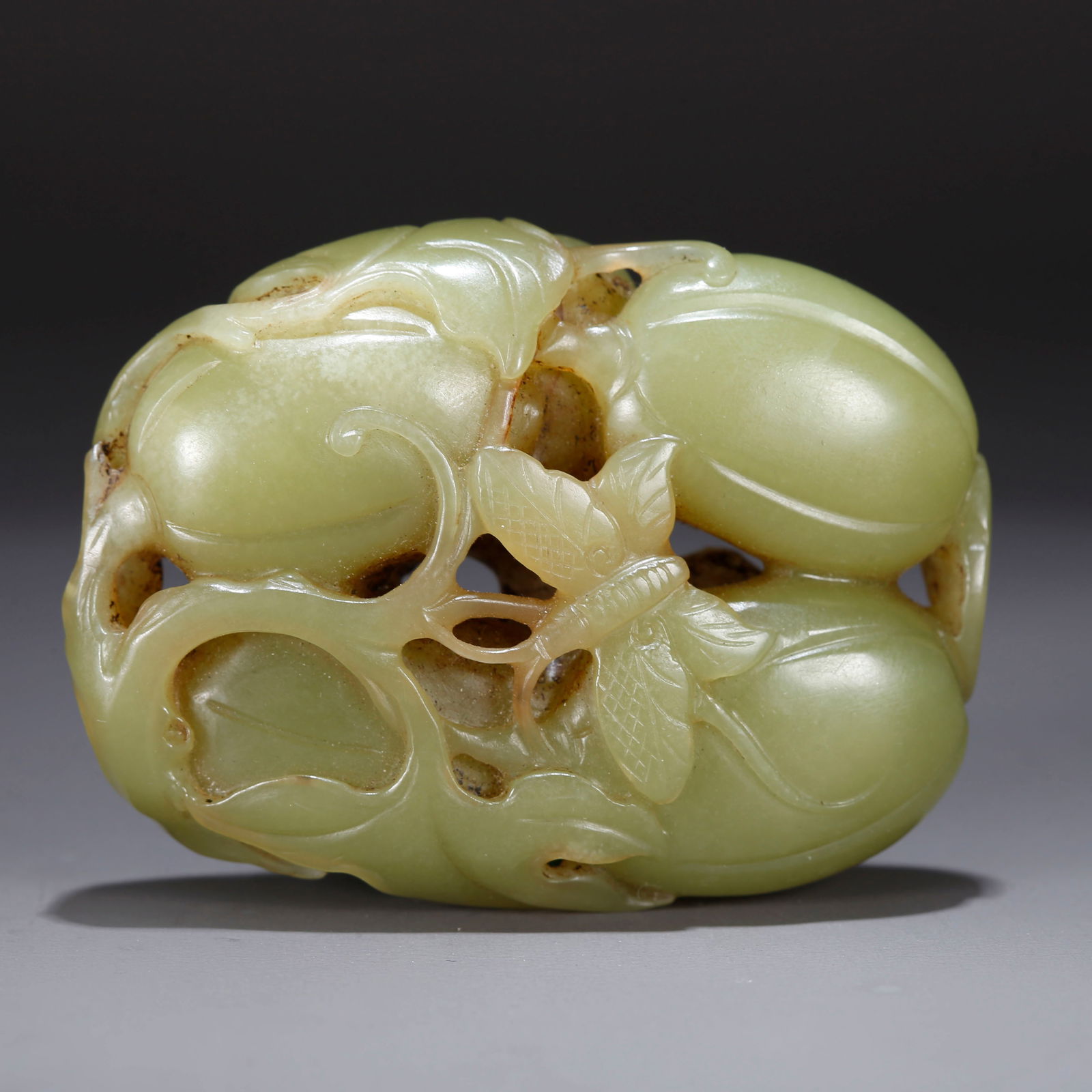 A HETIAN GREEN JADE ORNAMENT CARVED WITH MELONS AND FRUITS (1 of 9)