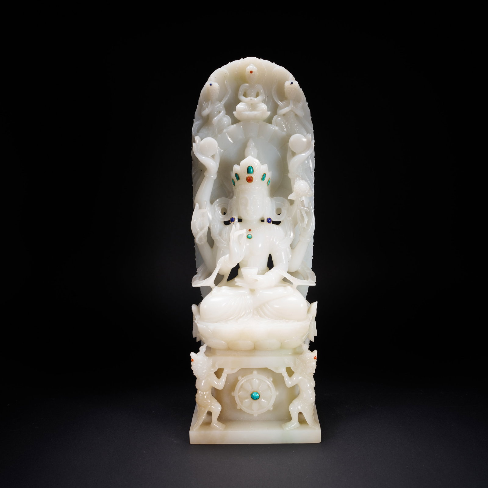A HETIAN JADE SEATED THOUSAND-ARMED AVALOKITESHVARA WITH GEMSTONE INLAY, MING DYNASTY (1 of 9)