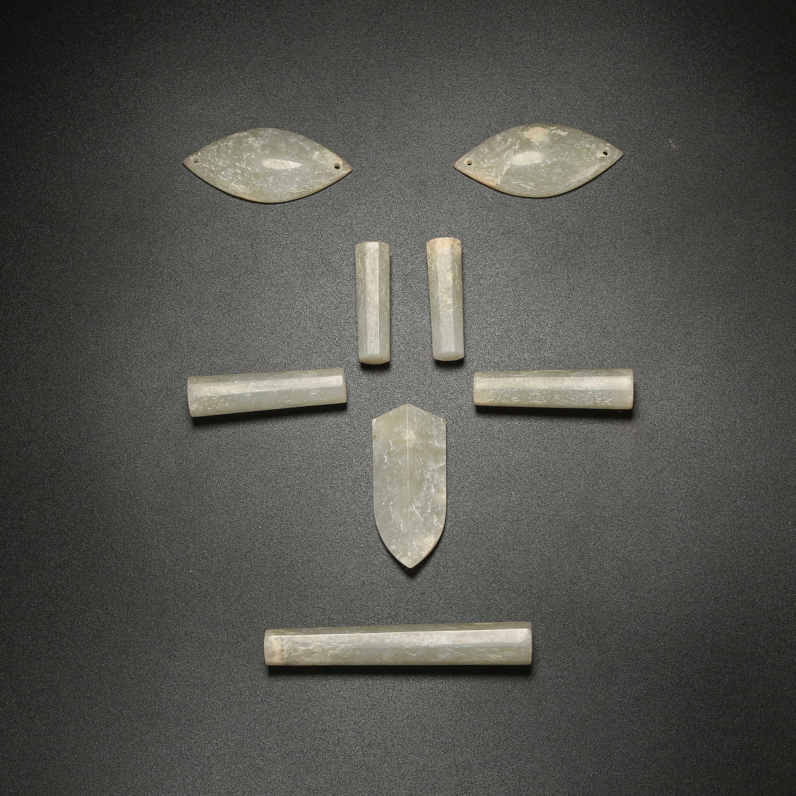 A SET OF ANCIENT JADE MASKS (1 of 9)