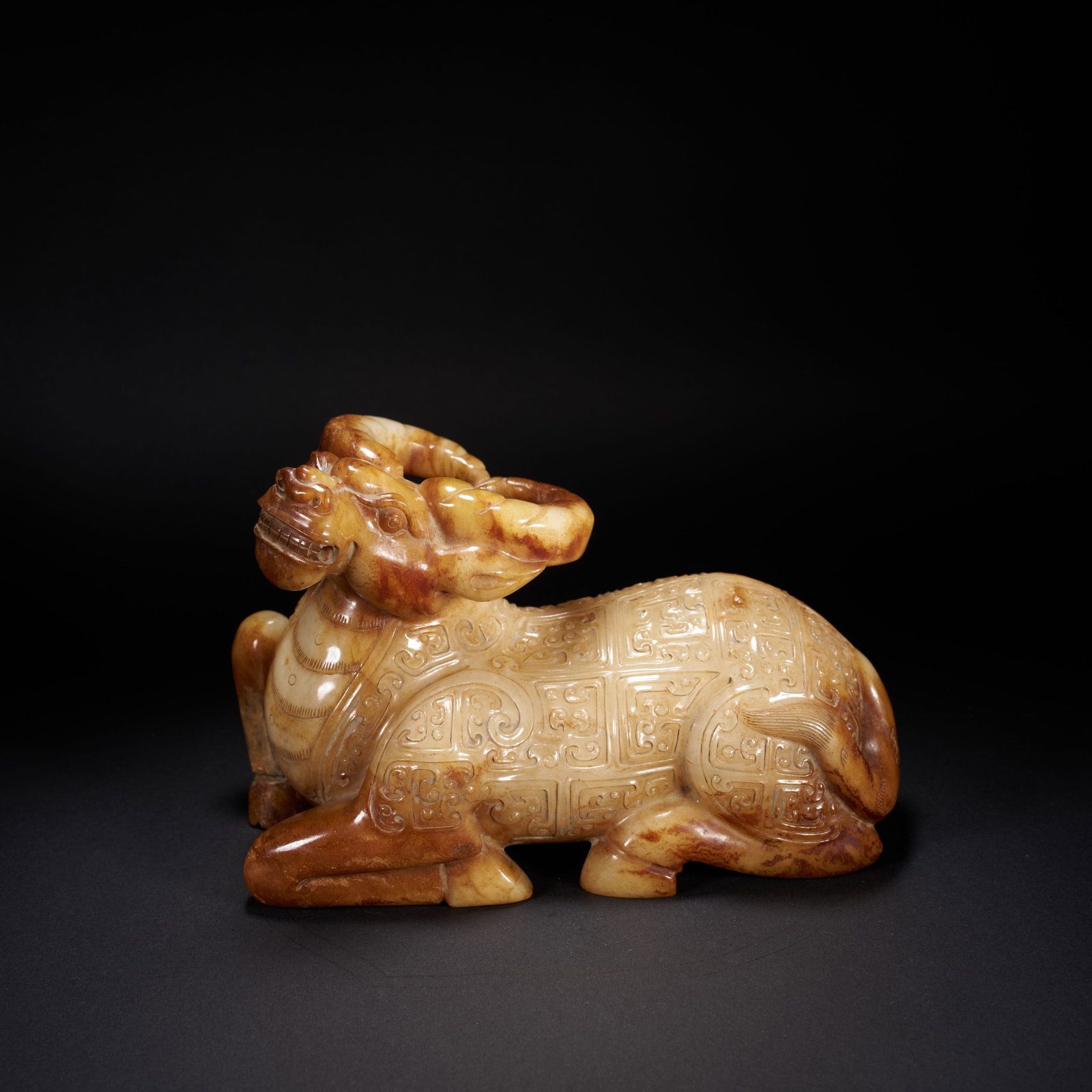 A HETIAN JADE RECUMBENT OX WITH LEIWEN (THUNDER) PATTERN, HAN DYNASTY (1 of 7)