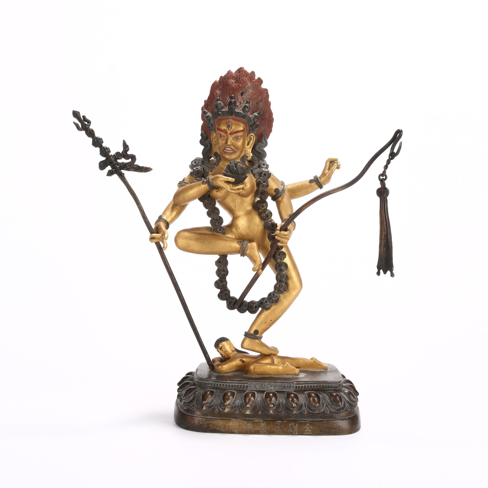 A BRONZE AND GILDED VAJRAYOGINI STATUE (1 of 10)