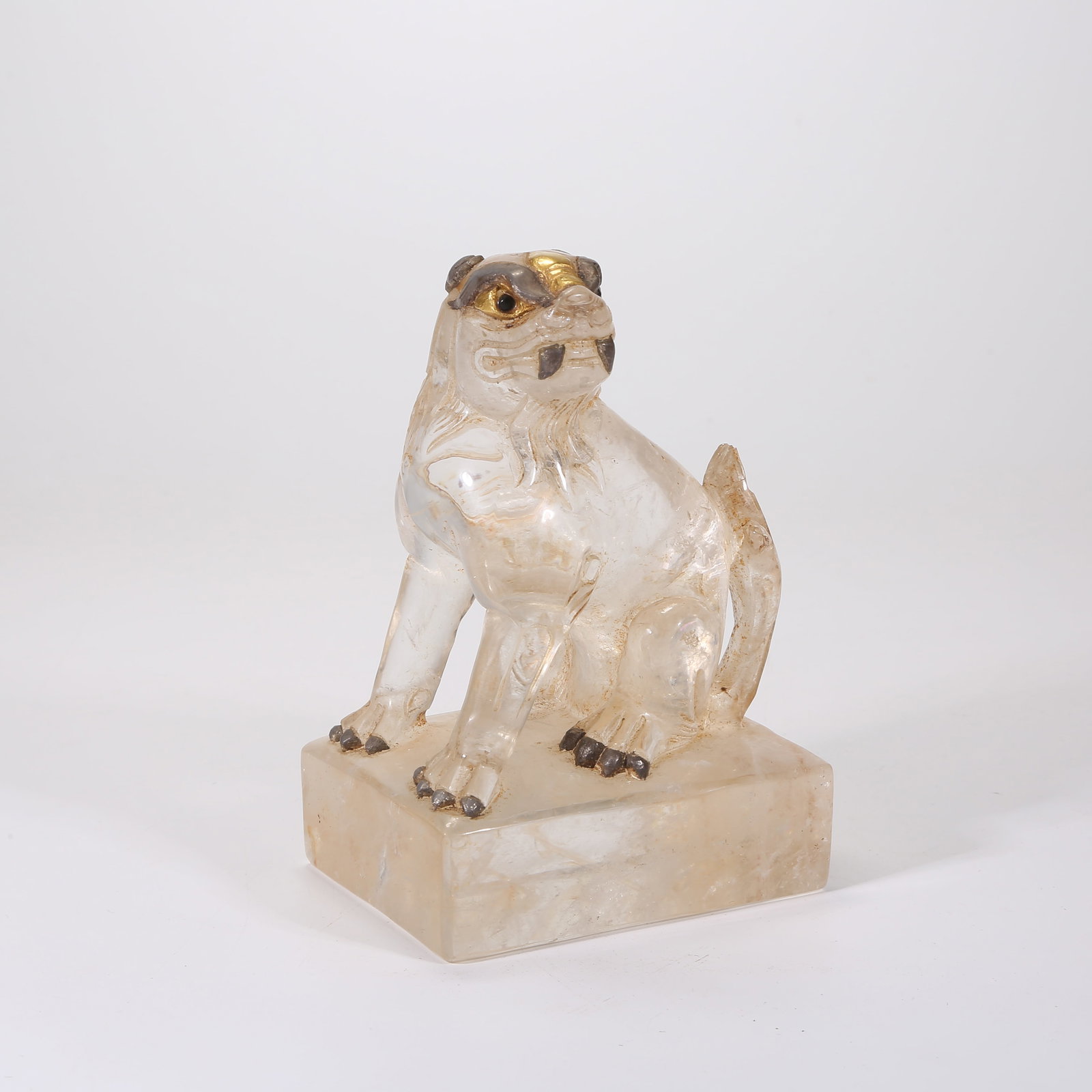 A CRYSTAL LION-SHAPED FIGURINE (1 of 8)
