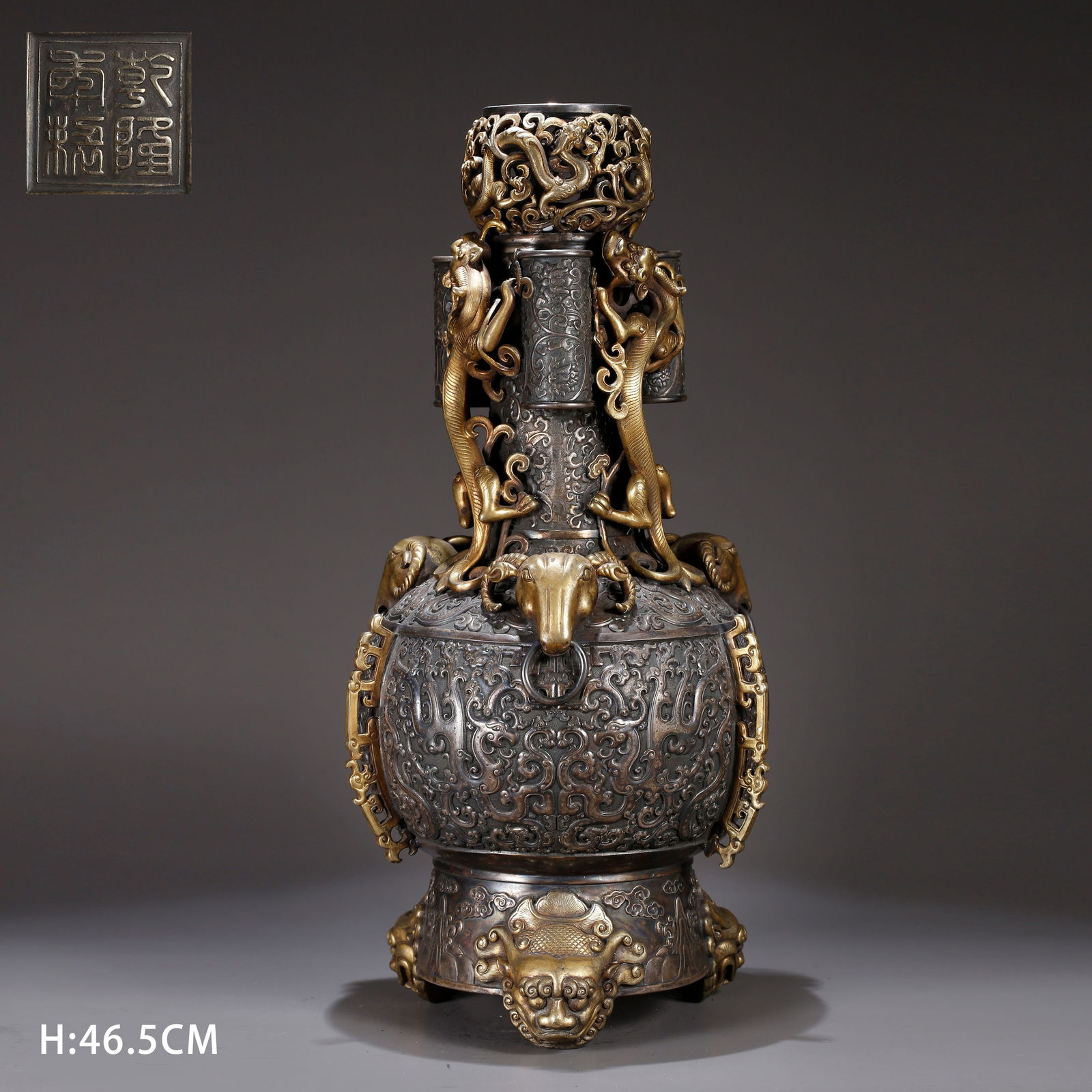 A GILT BRONZE TRIPLE-LOOP-HANDLED VASE: Gilt bronze triple-loop-handled vase