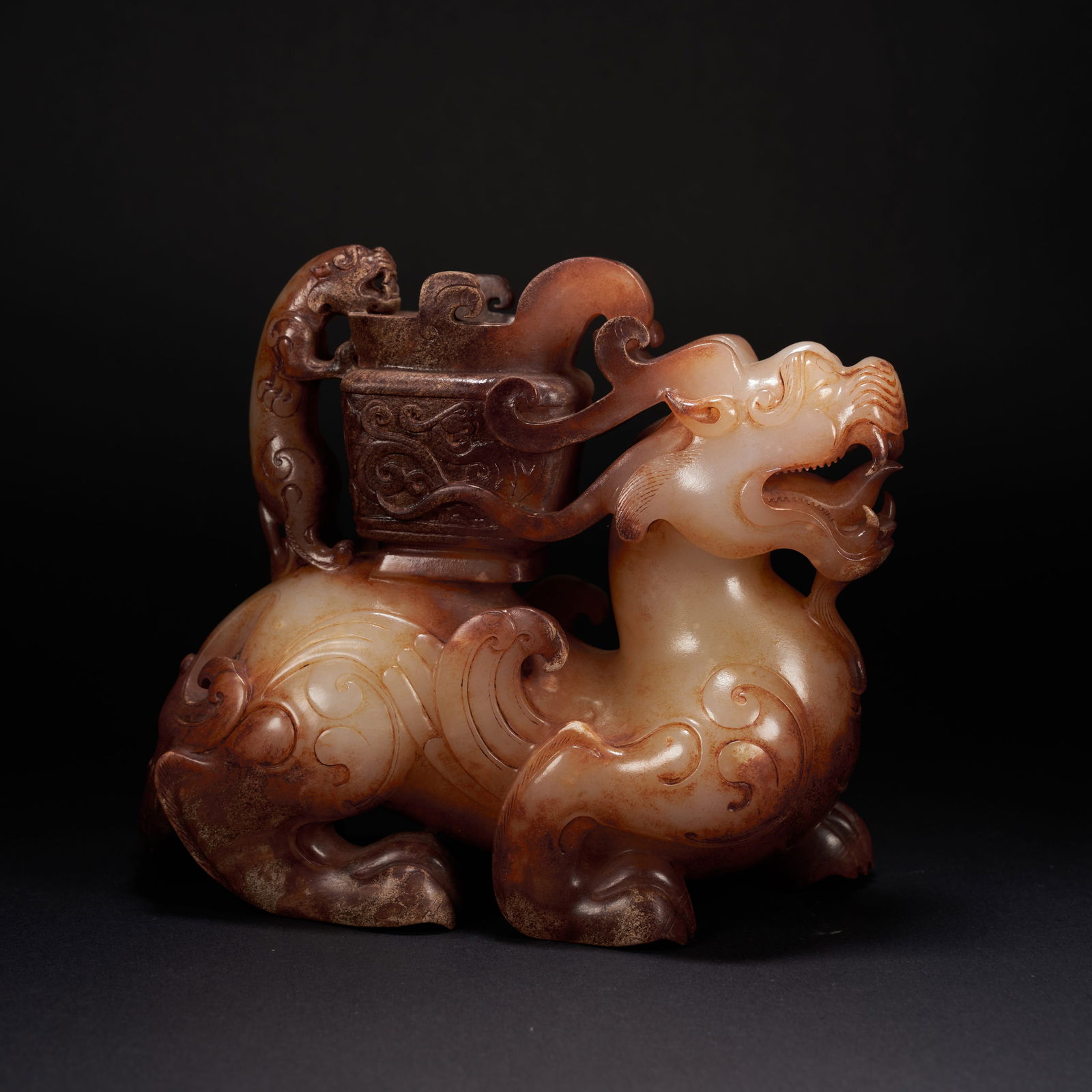 A HETIAN JADE AUSPICIOUS BEAST ORNAMENT, HAN DYNASTY (1 of 10)