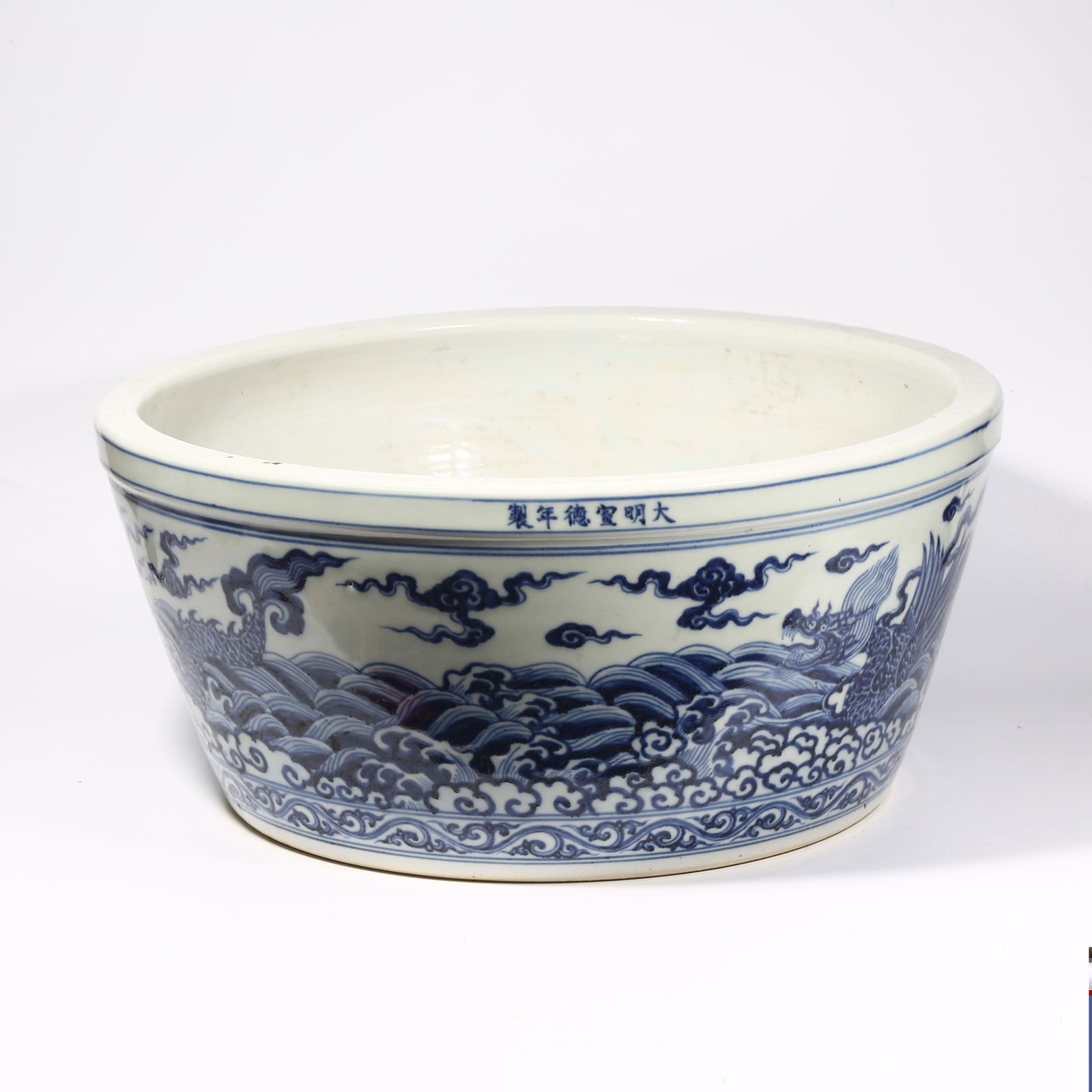 A BLUE AND WHITE DRAGON AMID WAVES ALTAR JAR: Blue and white dragon amid waves altar jar