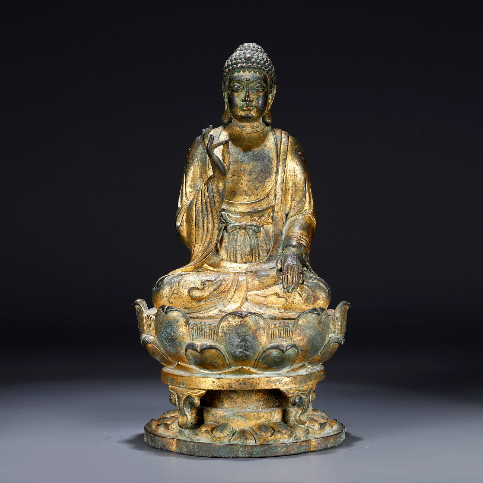 A GILT BRONZE STATUE OF VAIROCANA BUDDHA (1 of 9)