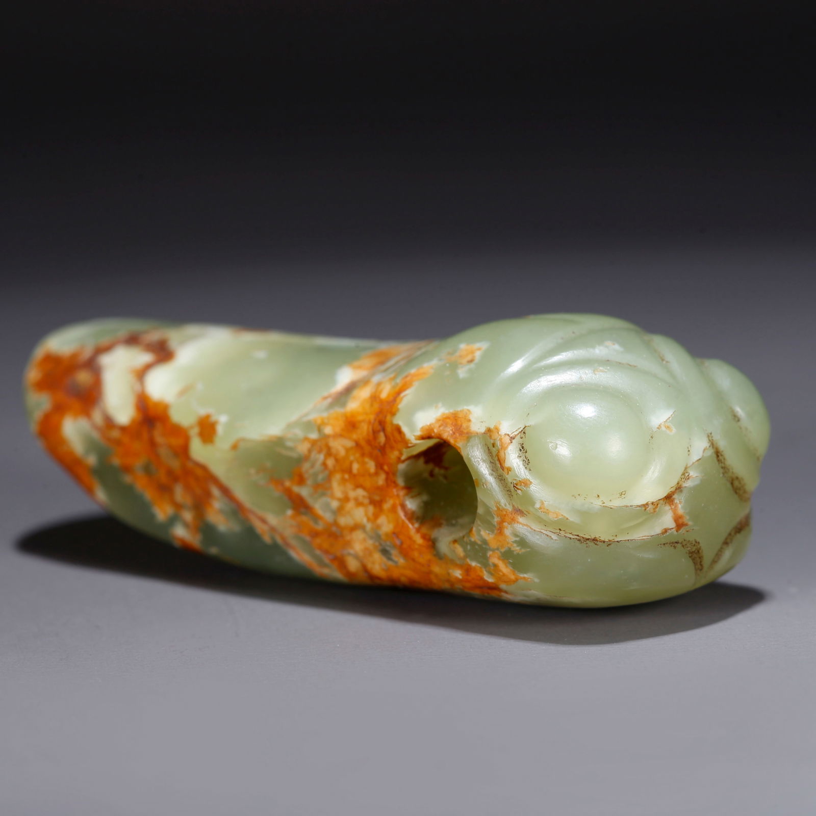 A HETIAN JADE ORNAMENT CARVED WITH "A SENSATIONAL DEBUT" (1 of 9)