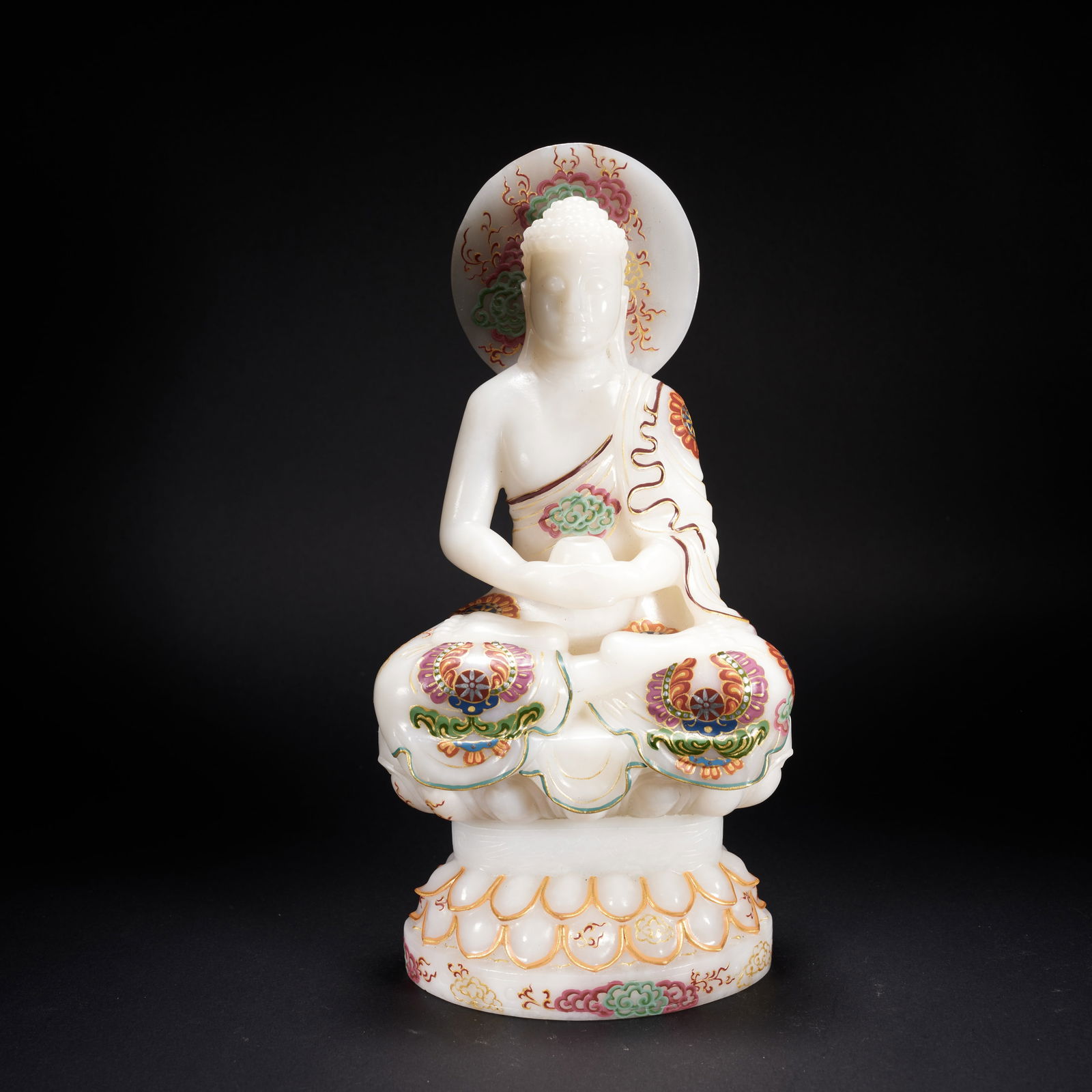 A PAINTED HETIAN JADE SEATED SHAKYAMUNI BUDDHA, TANG DYNASTY (1 of 9)