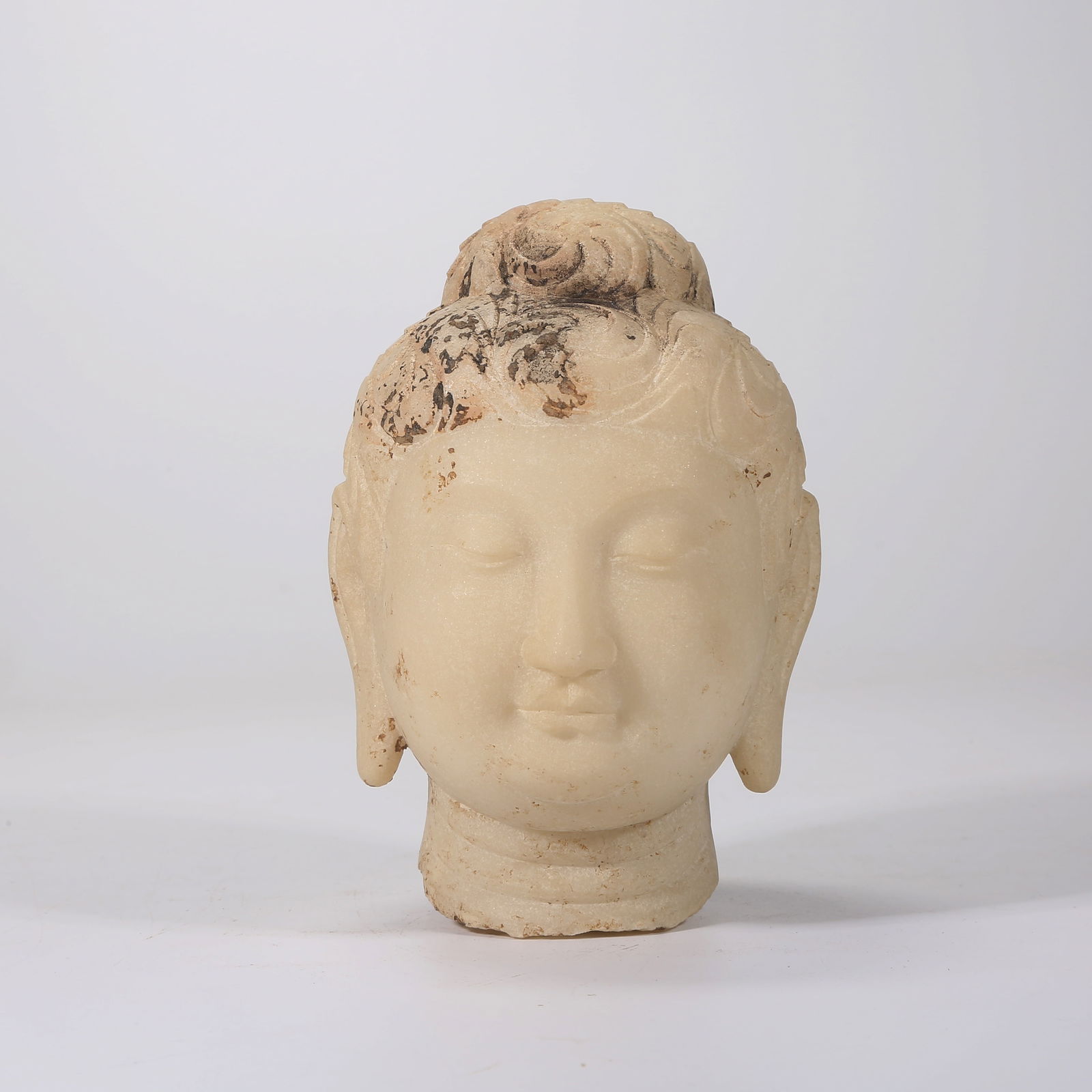 A WHITE MARBLE CARVED BUDDHA HEAD (1 of 8)
