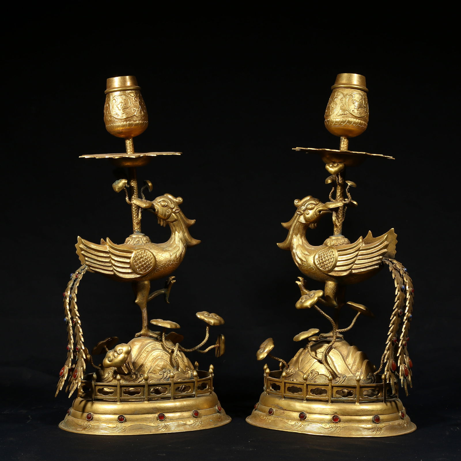 A GILDED BRONZE PHOENIX-SHAPED CANDLESTICK SET (1 of 11)